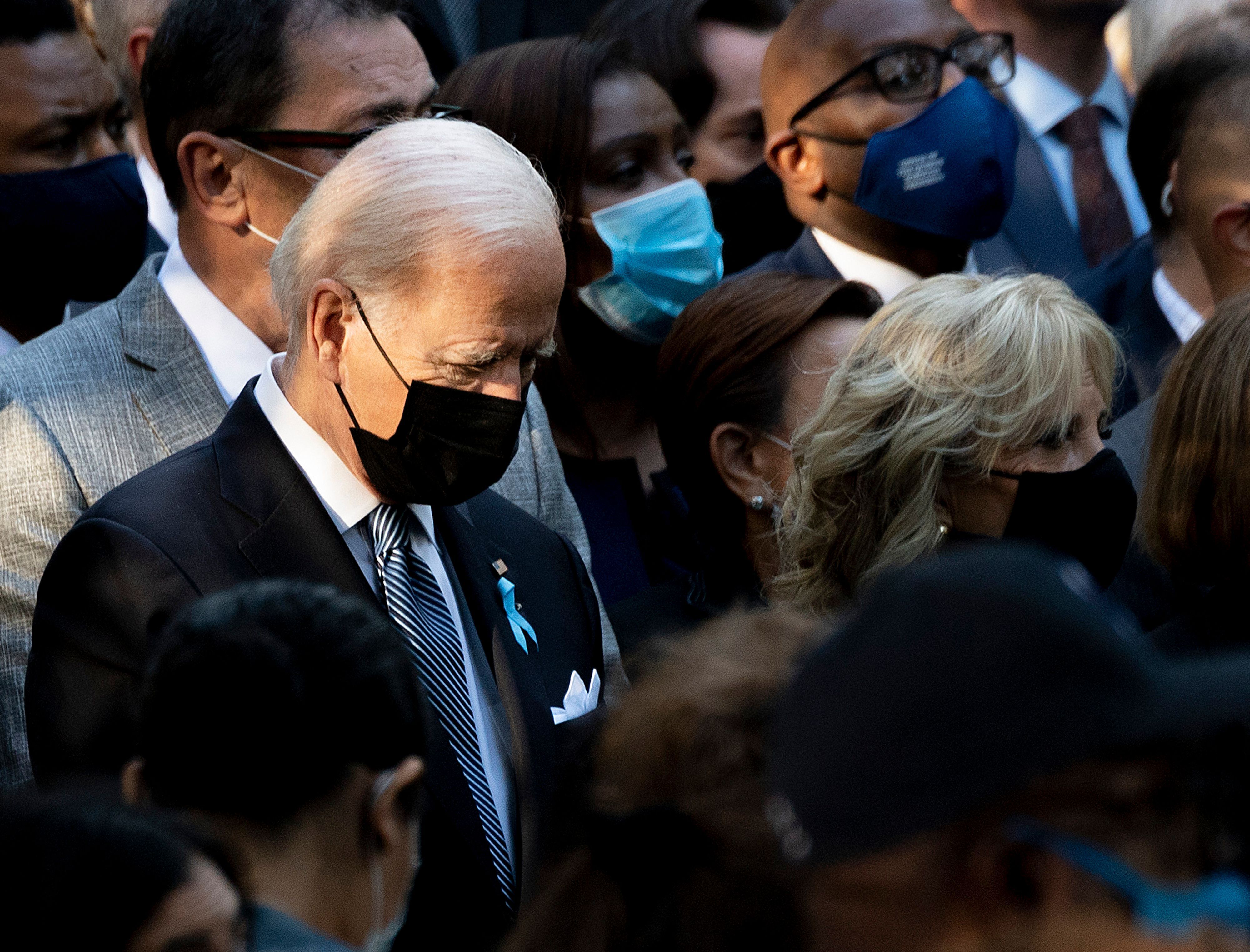 President Joe Biden, with First Lady Jill Biden (R), attends the ceremony at the National 9/11 Memorial marking the 20th anniversary of the 9/11 attacks