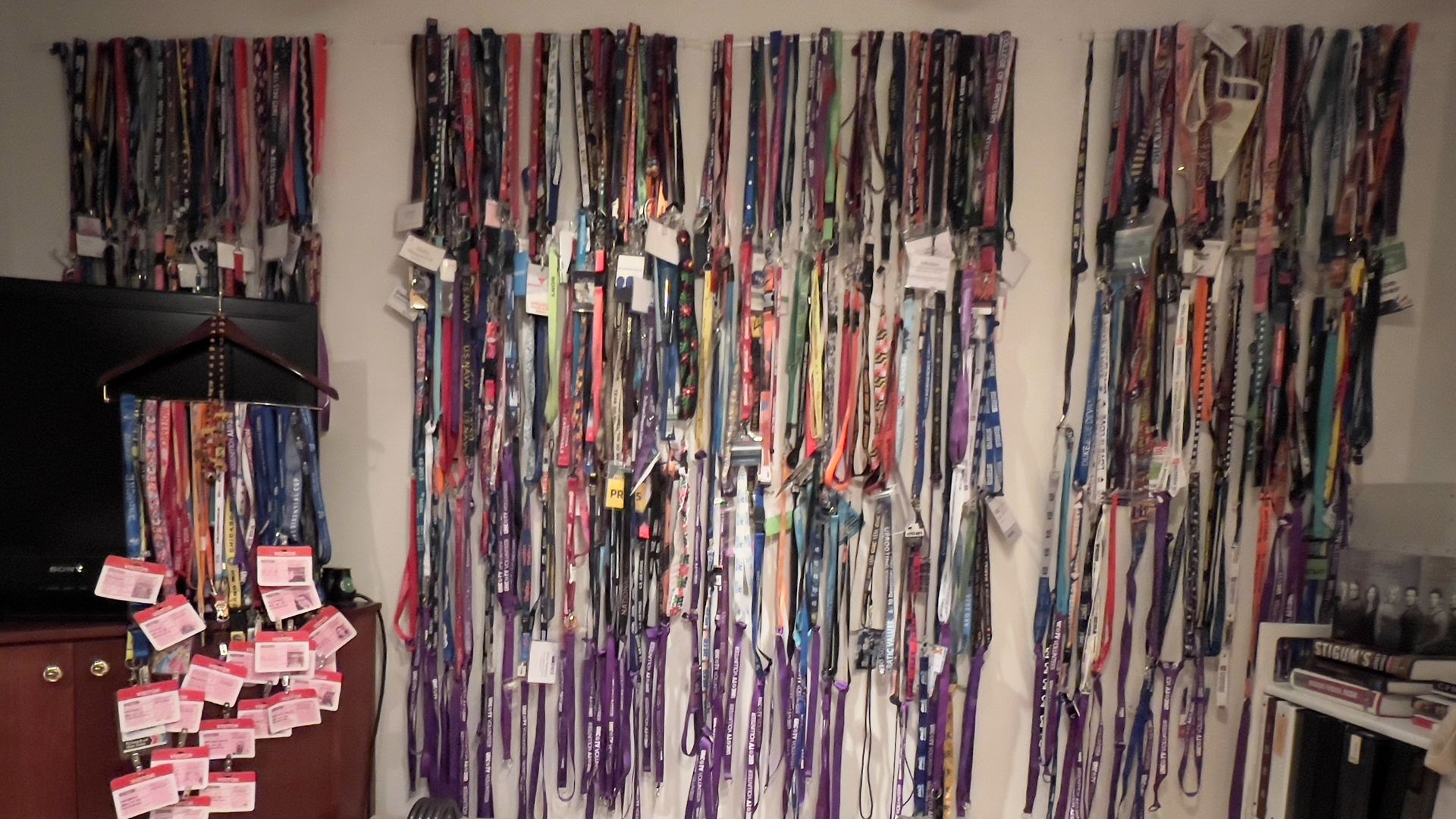 collection of 475 lanyards hanging on a wall