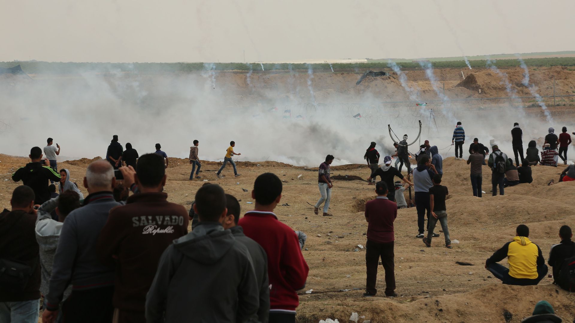 Tear gas canisters are fired by Israeli troops at Palestinian demonstrators on Friday.