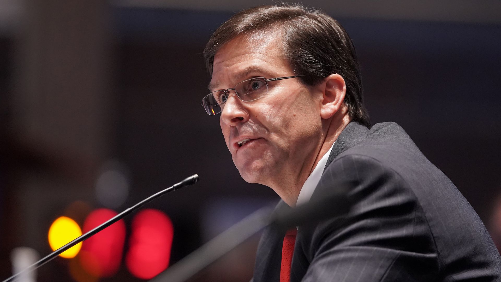 Mark Esper speaks into a microphone