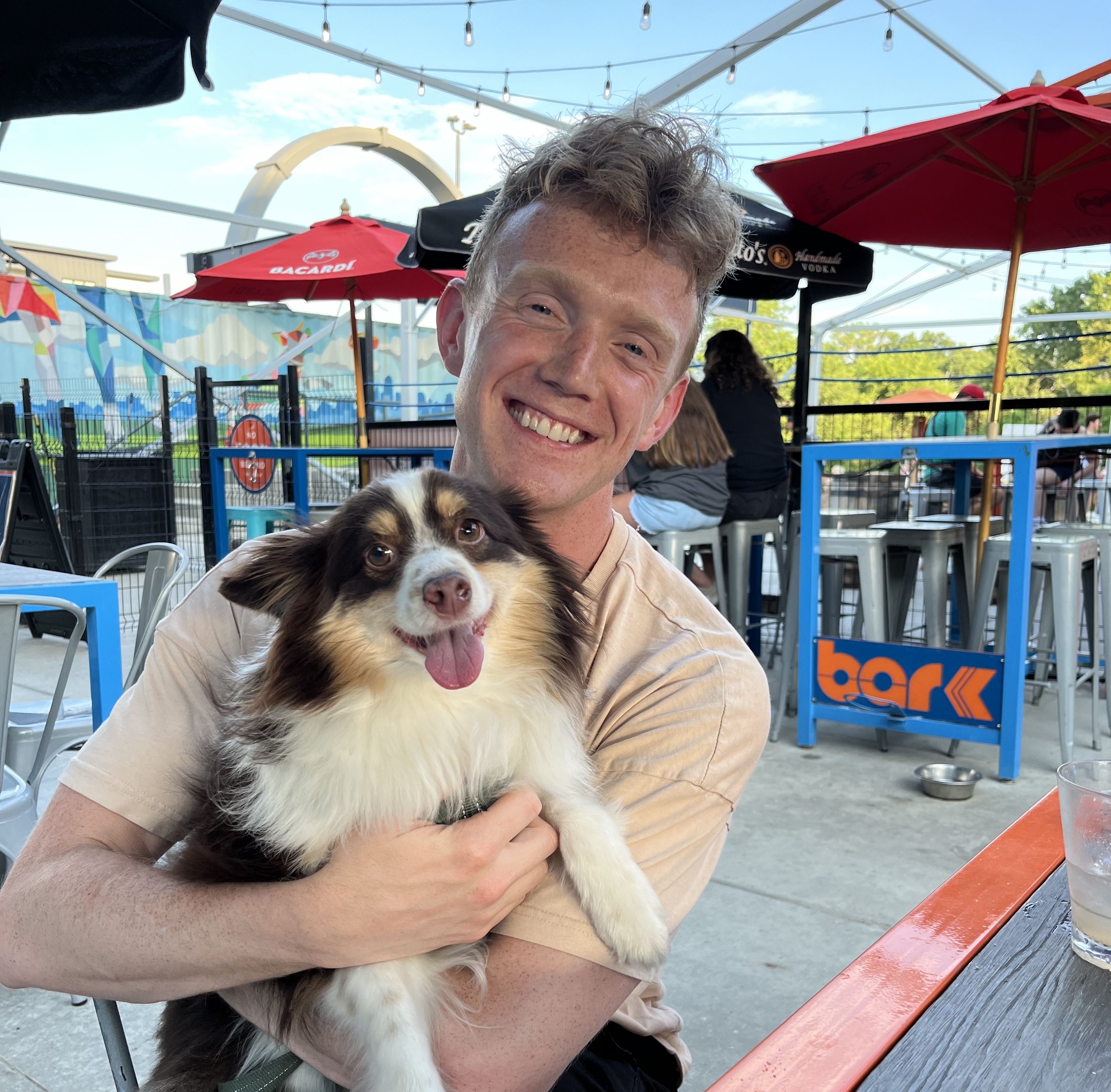 Photo of Ollie being held by his friend, Brandon at Bar K.