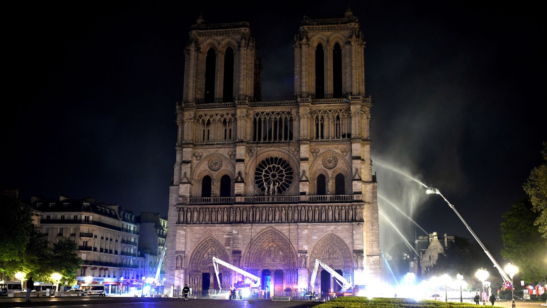 Firefighters douse flames at Notre Dame Cathedral in Paris.