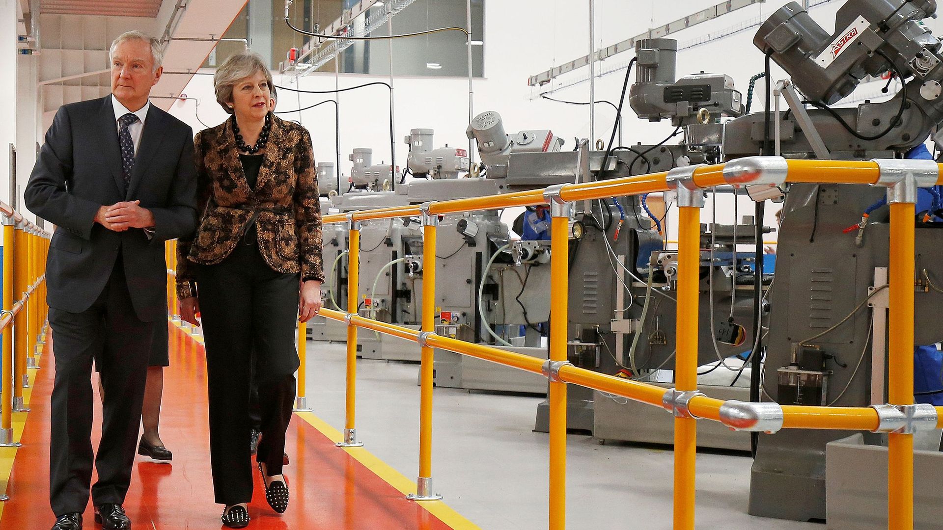 Theresa May visits an engineering facility.