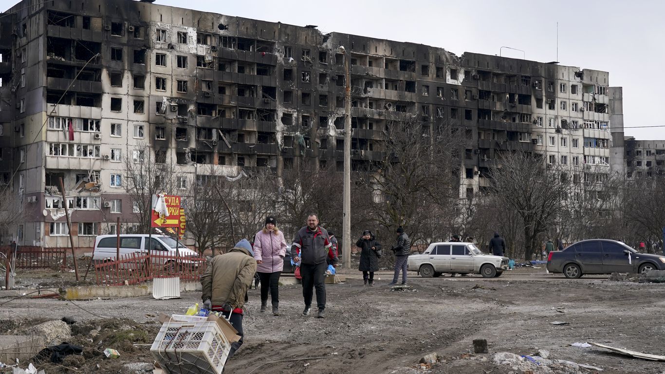 Civilians trapped in Mariupol under Russian attacks are evacuated in groups under the control of pro-Russian separatists, through other cities on March 20. 