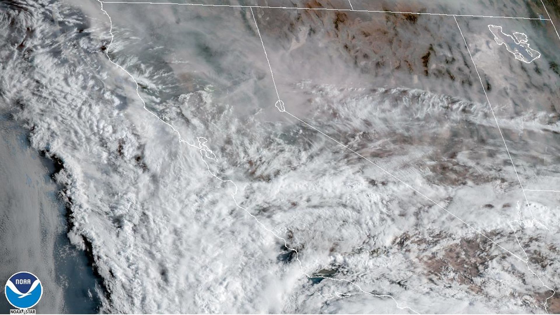 A NOAA satellite image showing smoke across the Western U.S. on Saturday.