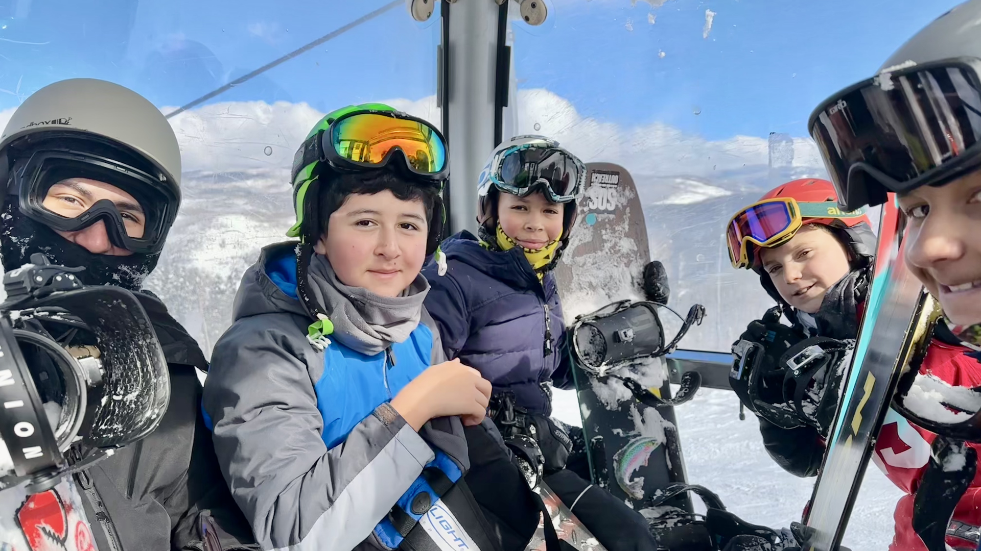 From left to right, Alberto Marquez, Juan Carlos Granillo,  Jair Armenta, Chase Chaknova and Jamal Hutchinson ride a gondola at Beaver Creek ski resort Feb. 4. Photo: John Frank/Axios