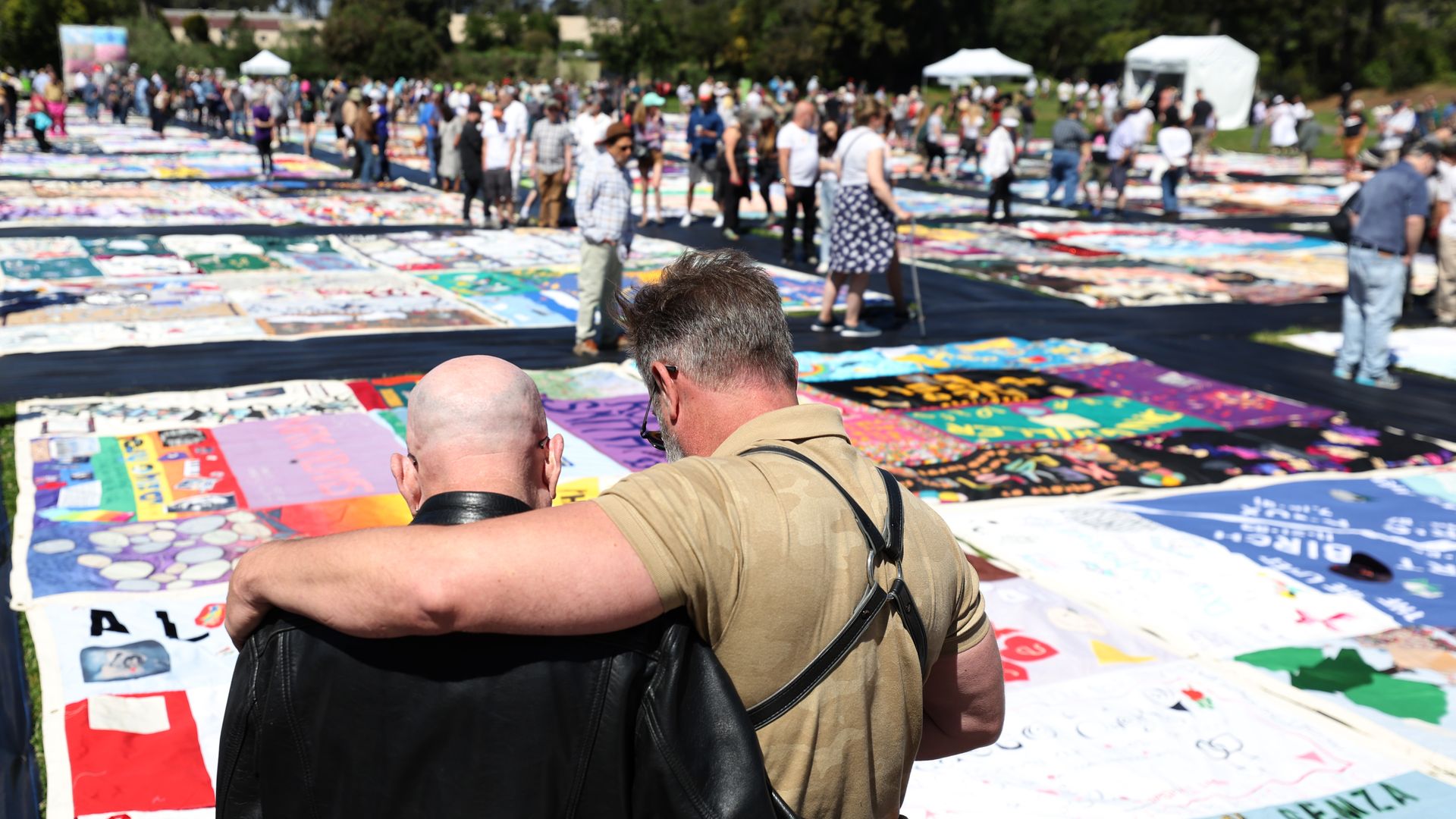 People at a quilt memorial display for people who died from AIDS in San Francisco in June 2022.