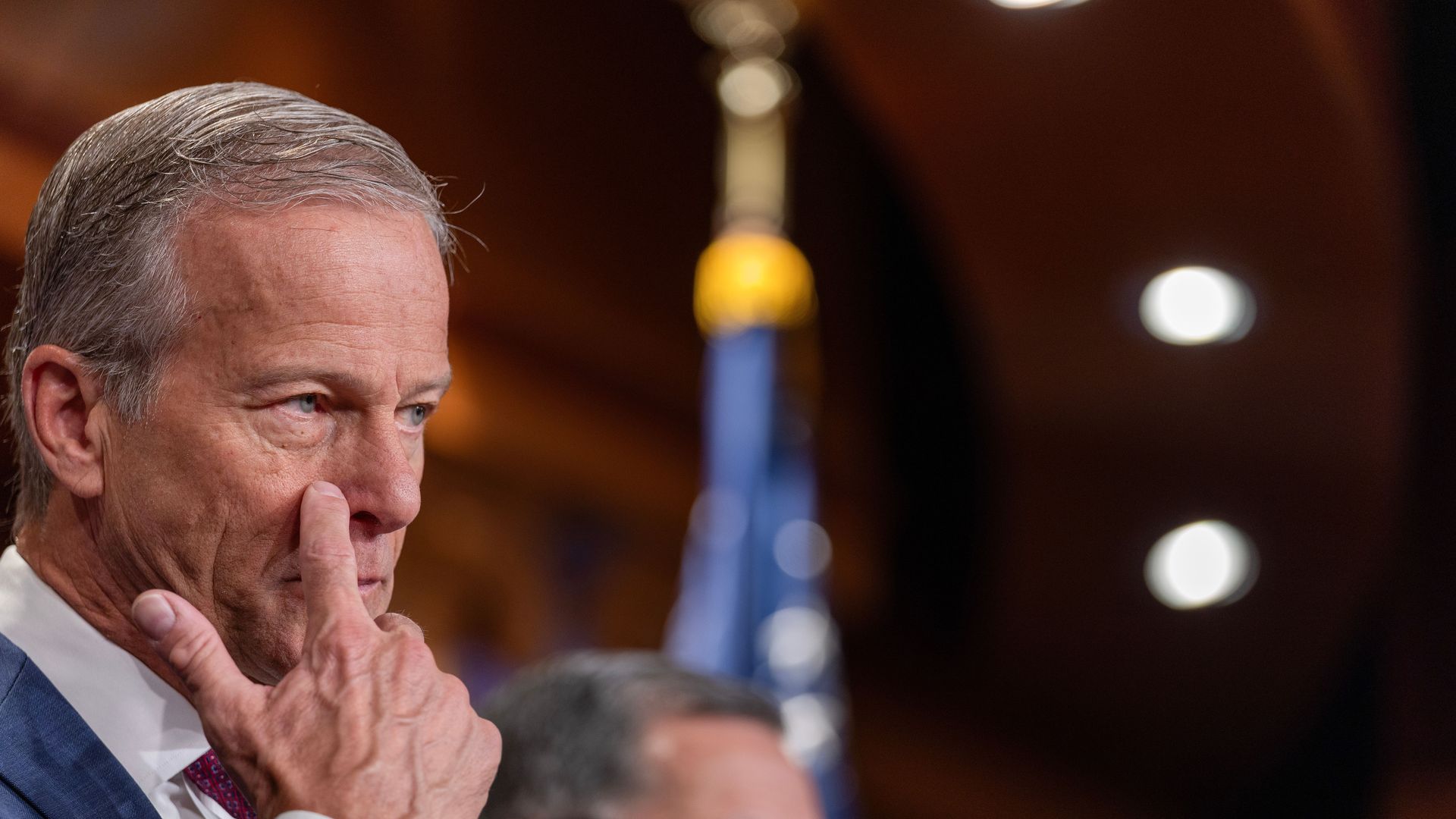 Senate Majority Leader John Thune takes questions during a press conference on March 21 on Capitol Hill.
