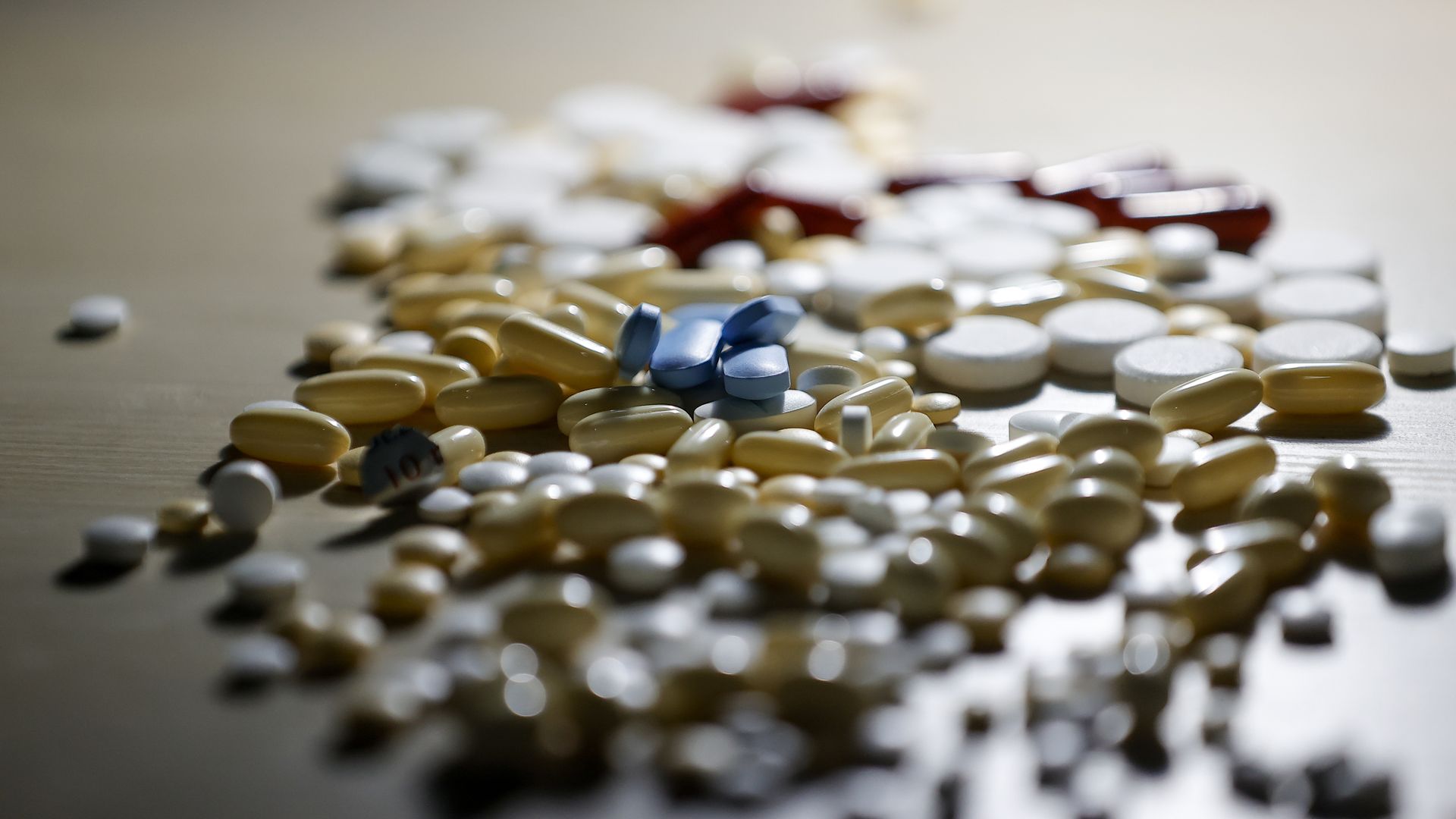 Pills scattered on a table.