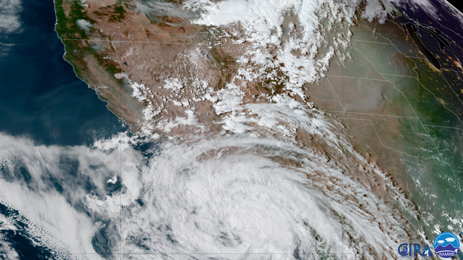Satellite image showing Hurricane Kay moving up the Baja Peninsula, while a wildfire burns in California.