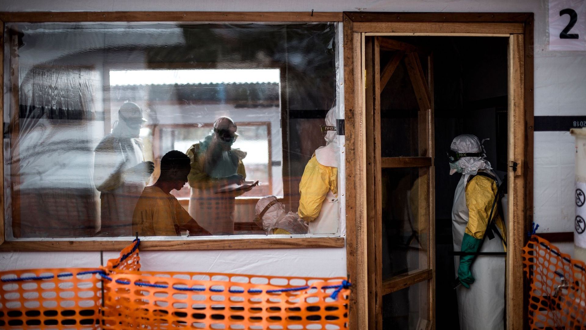 Doctors treating a patient at an Ebola treatment unit