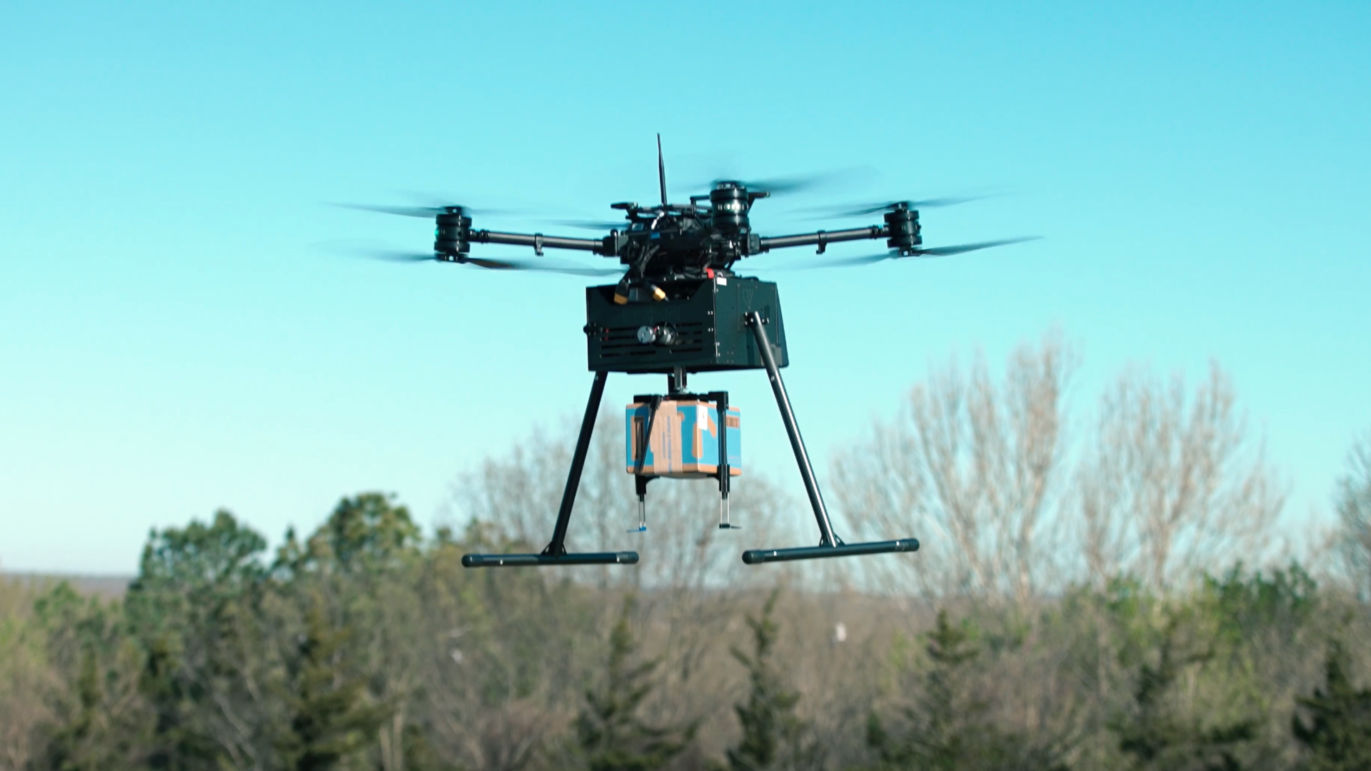 Image of a DroneUp drone delivering a package for Walmart