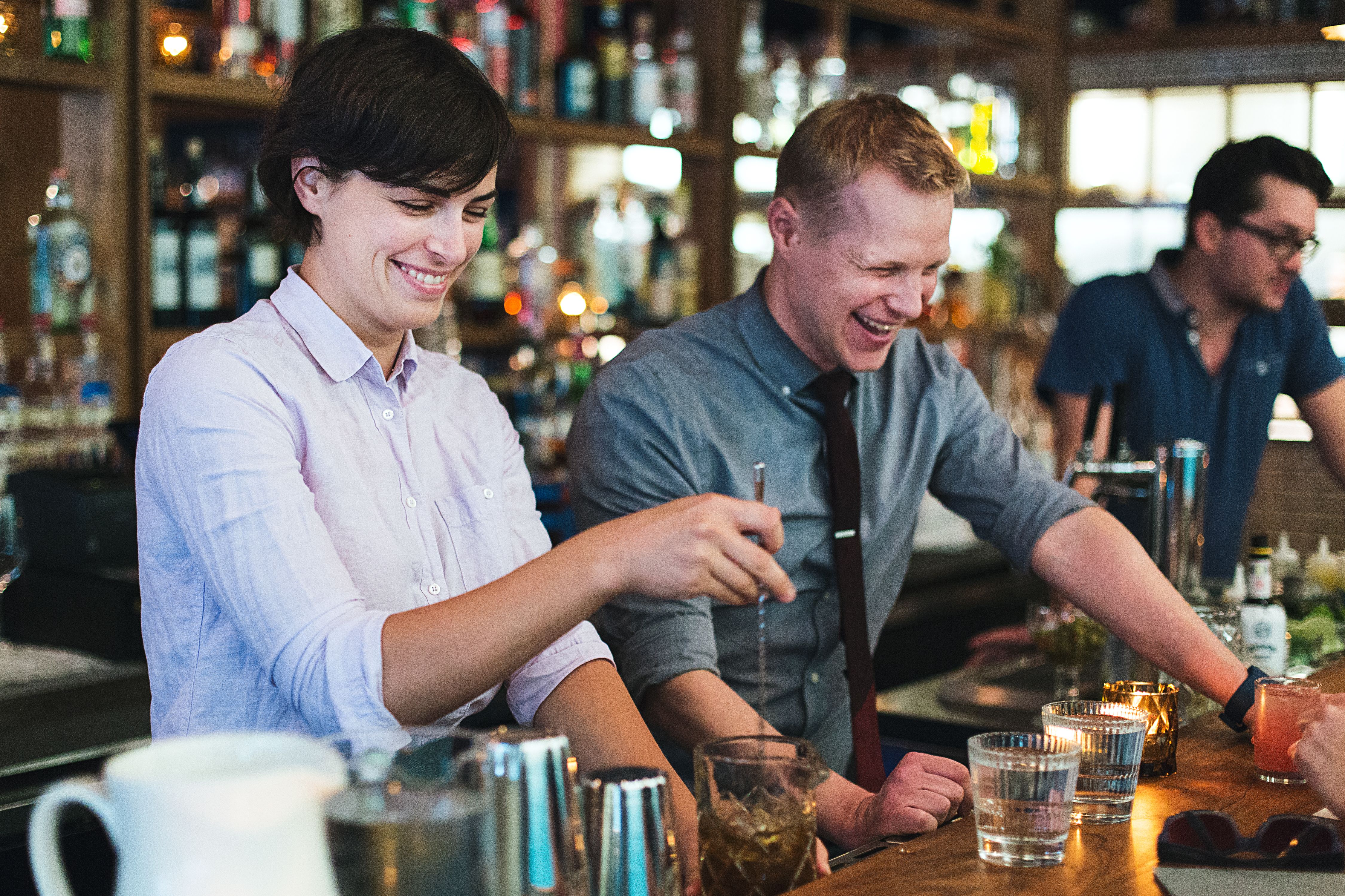 Bill Jensen and two other staff members behind the bar 