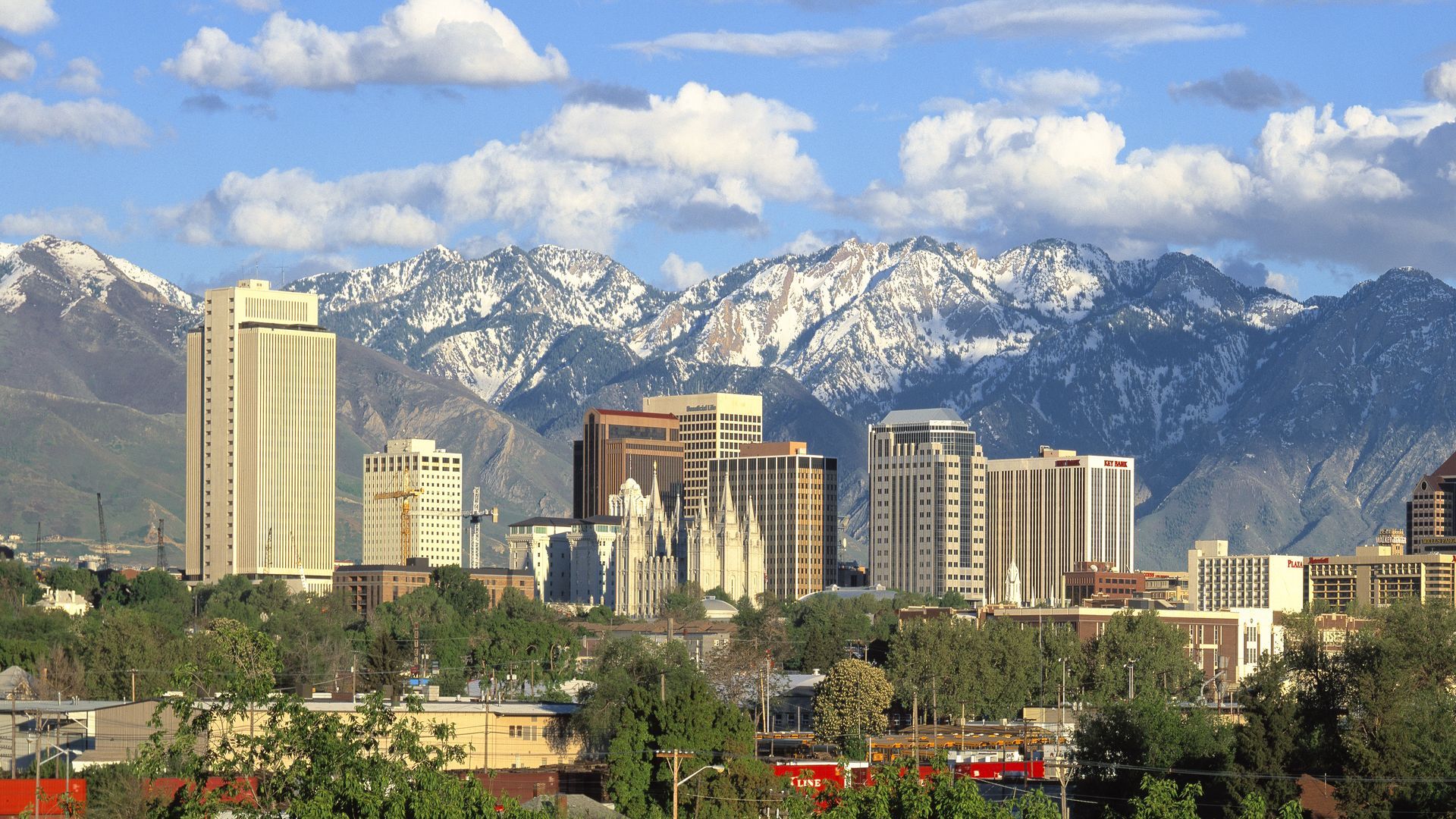 Salt Lake City skyline with mountains in the background.