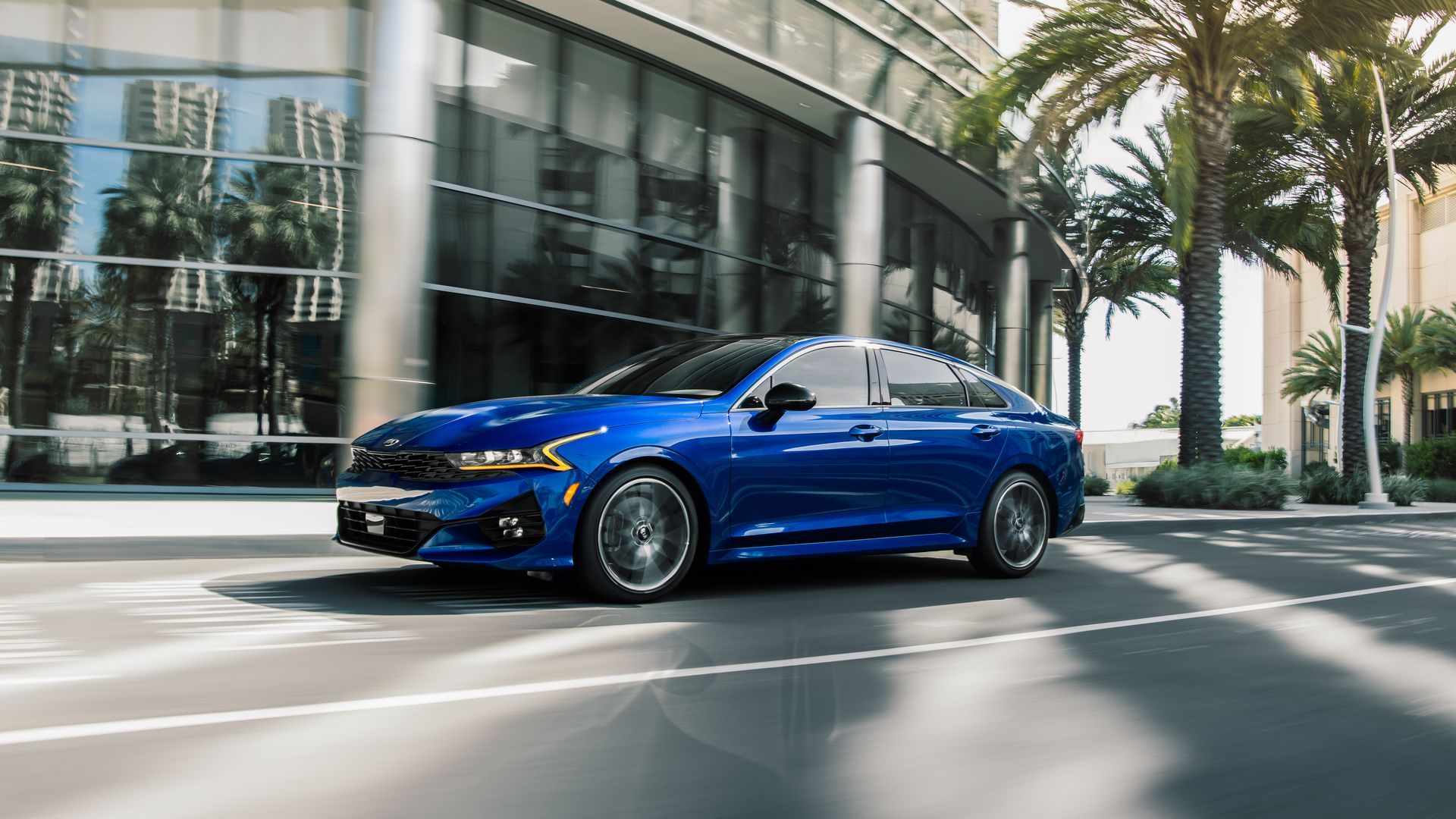 Photo of a blue 2021 Kia K5 on the road