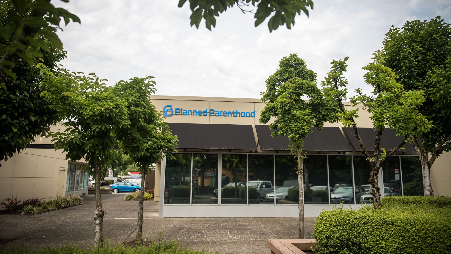 A photo of a building with blue letters that reads "Planned Parenthood"