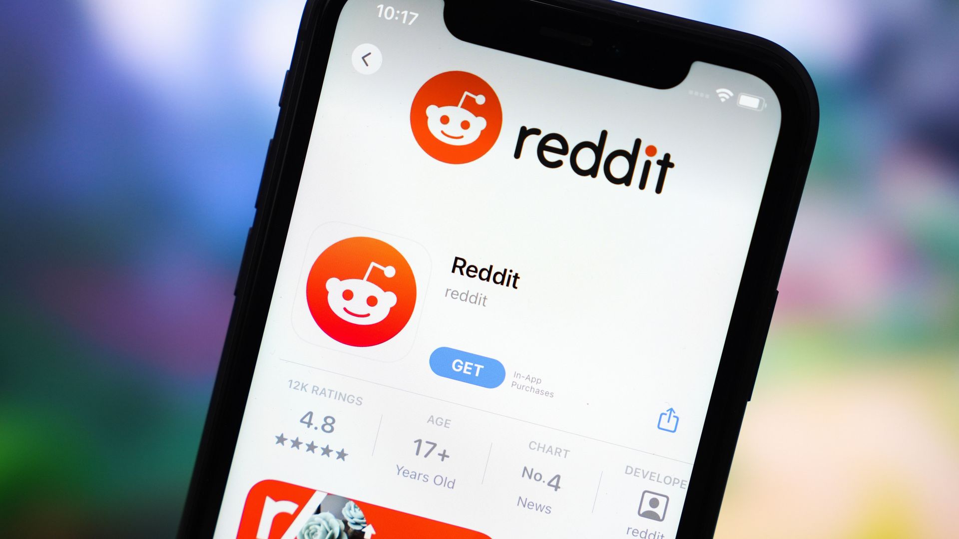  In this photo illustration, the Reddit app logo is displayed in the App Store on an iPhone.