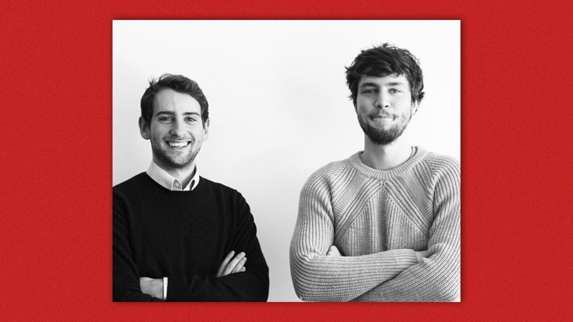 A photo of two men with their arms folded