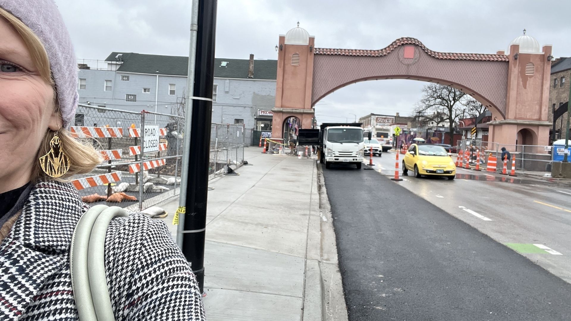 woman in front of an arch