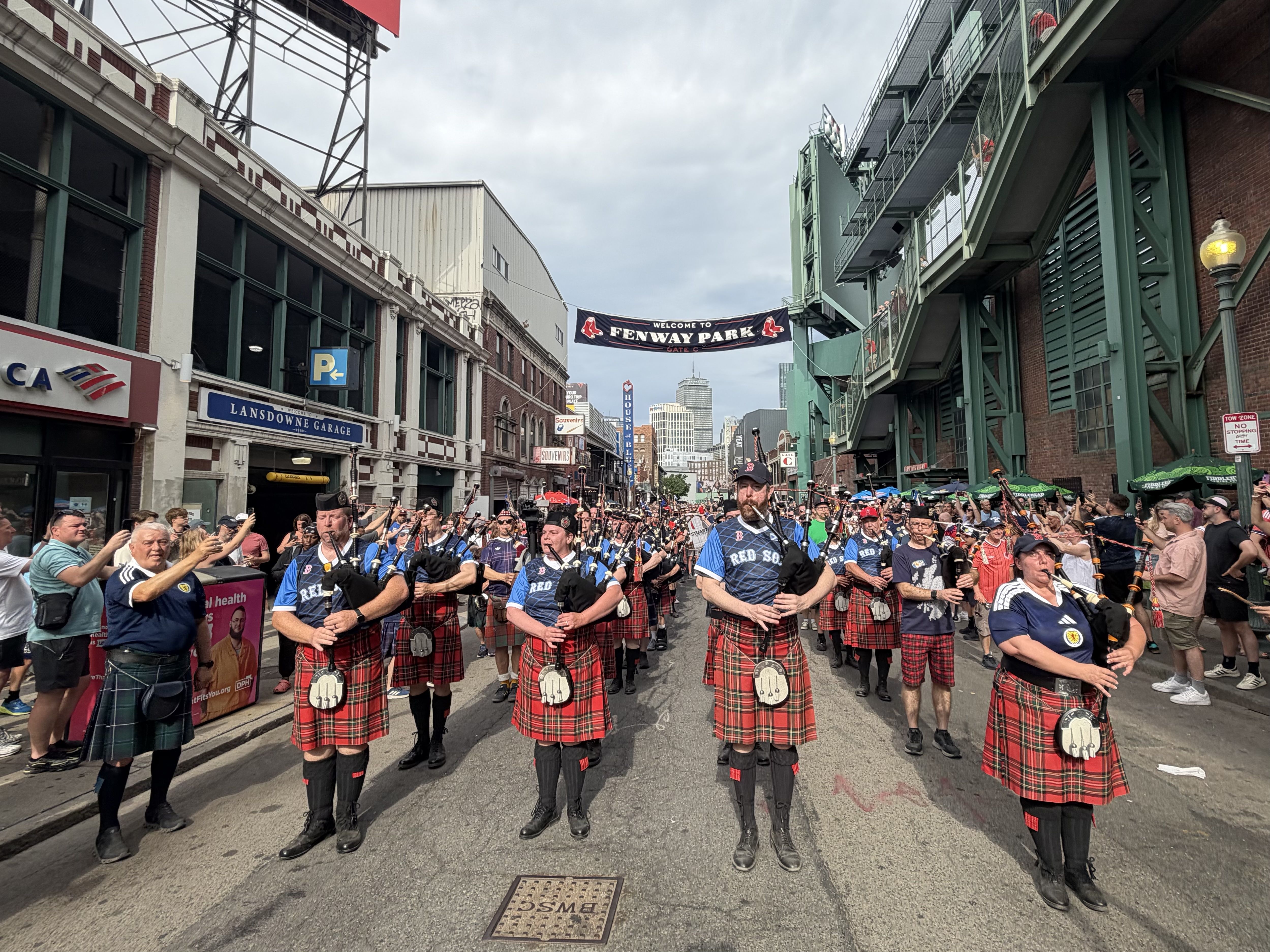Bagpipe players, including members of the Stuart Highlanders from Greater Boston, play outside of Fenway Park surrounded by Scotland fans on Sunday, June 14, 2026.