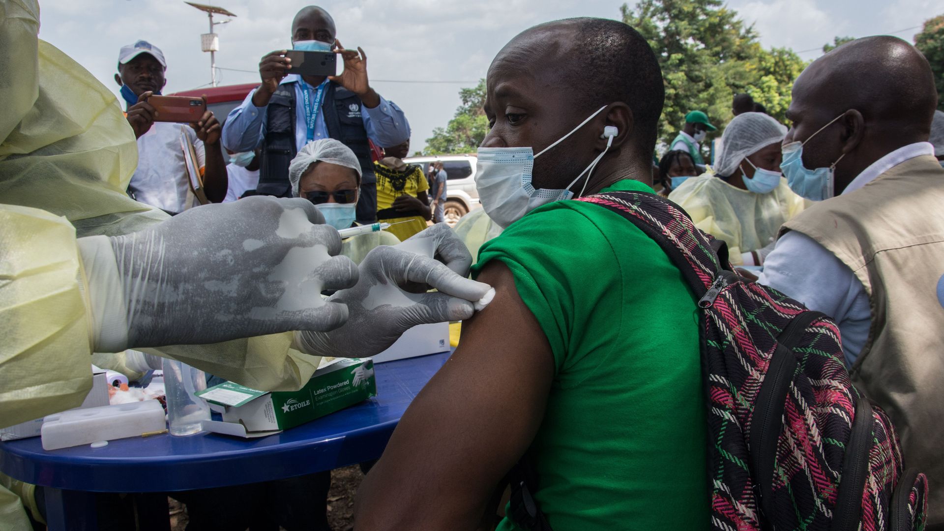 Picture of a man in Guinea getting an anti-Ebola vaccine in Guinea
