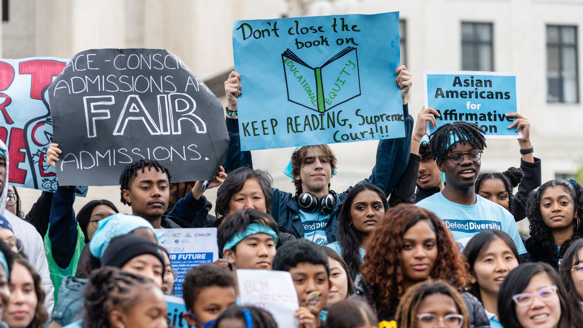 Supporters pose for a group photo during a rally in support affirmative action policies outside the Supreme Court in Washington, D.C. on October 31, 2022.