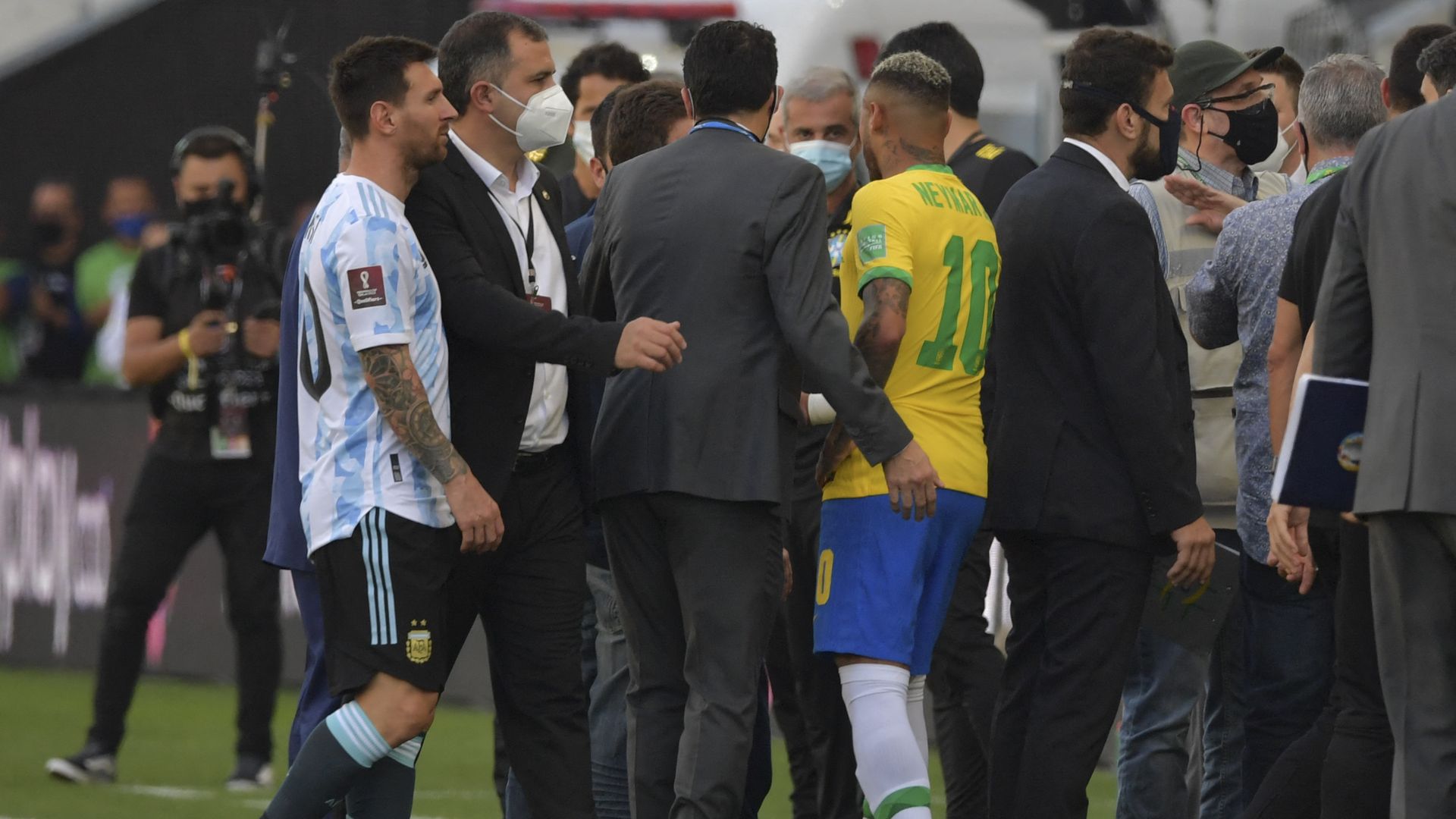 Argentina's Lionel Messi and Brazil's Neymar as health officials enter the field during the FIFA World Cup Qatar 2022 qualifier between Brazil and Argentina in Brazil
