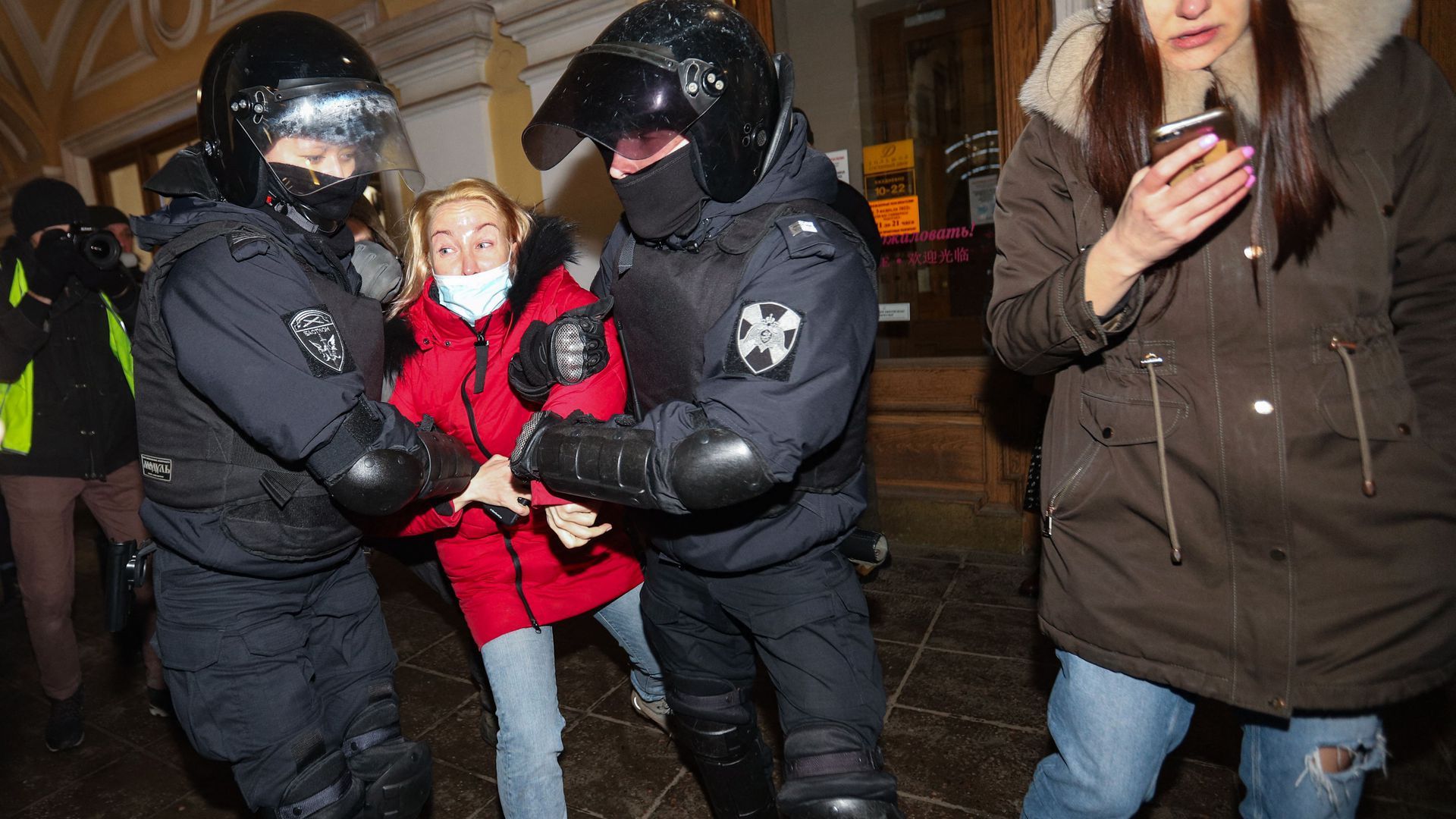 Police in Russia arresting a person participating in a protest against Russia's invasion of Ukraine in Saint Petersburg