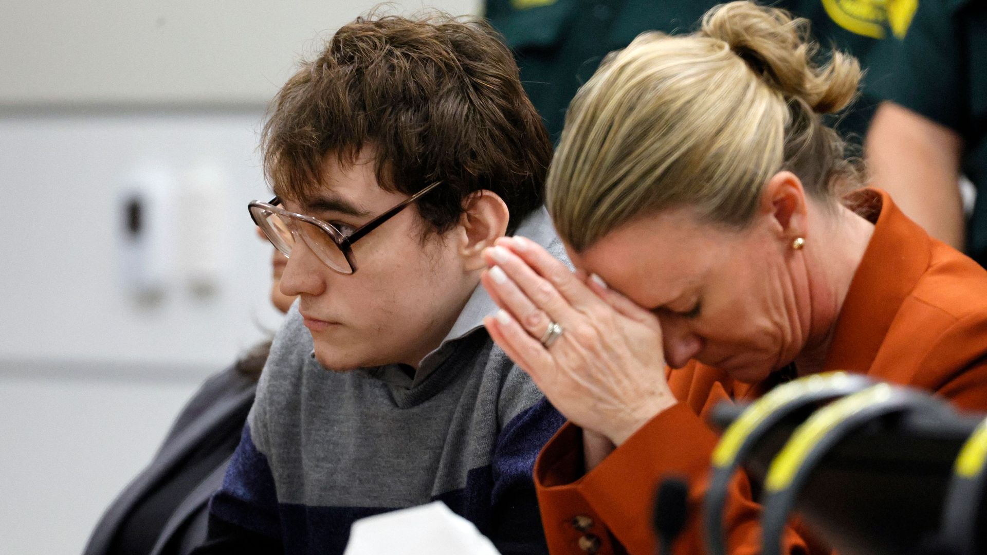 Nikolas Cruz and assistant public defender Melisa McNeill listen at the Broward County Courthouse on Oct. 13.