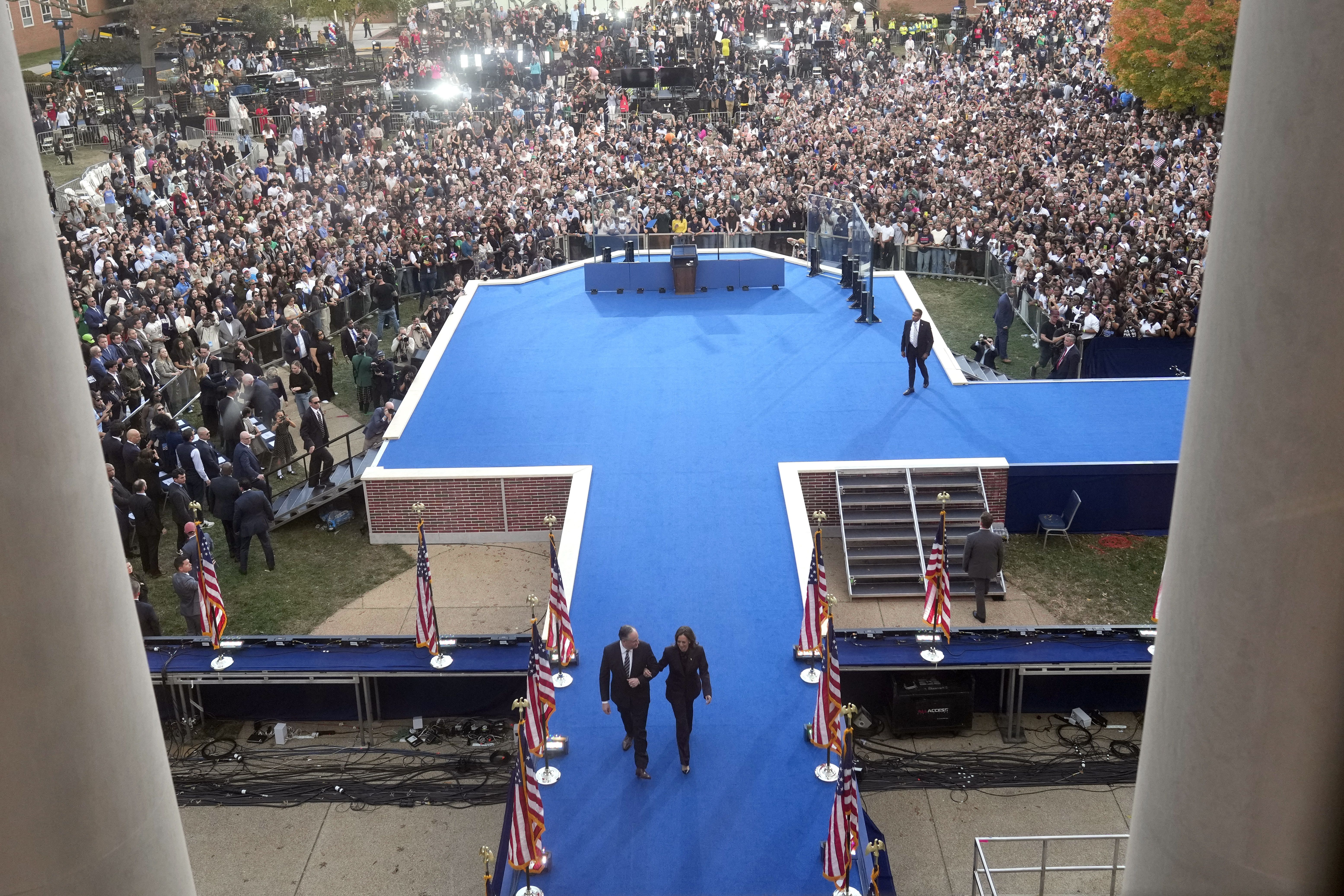 Vice President Harris leaves the stage with Second Gentleman Doug Emhoff after delivering her concession speech yesterday at Howard University.