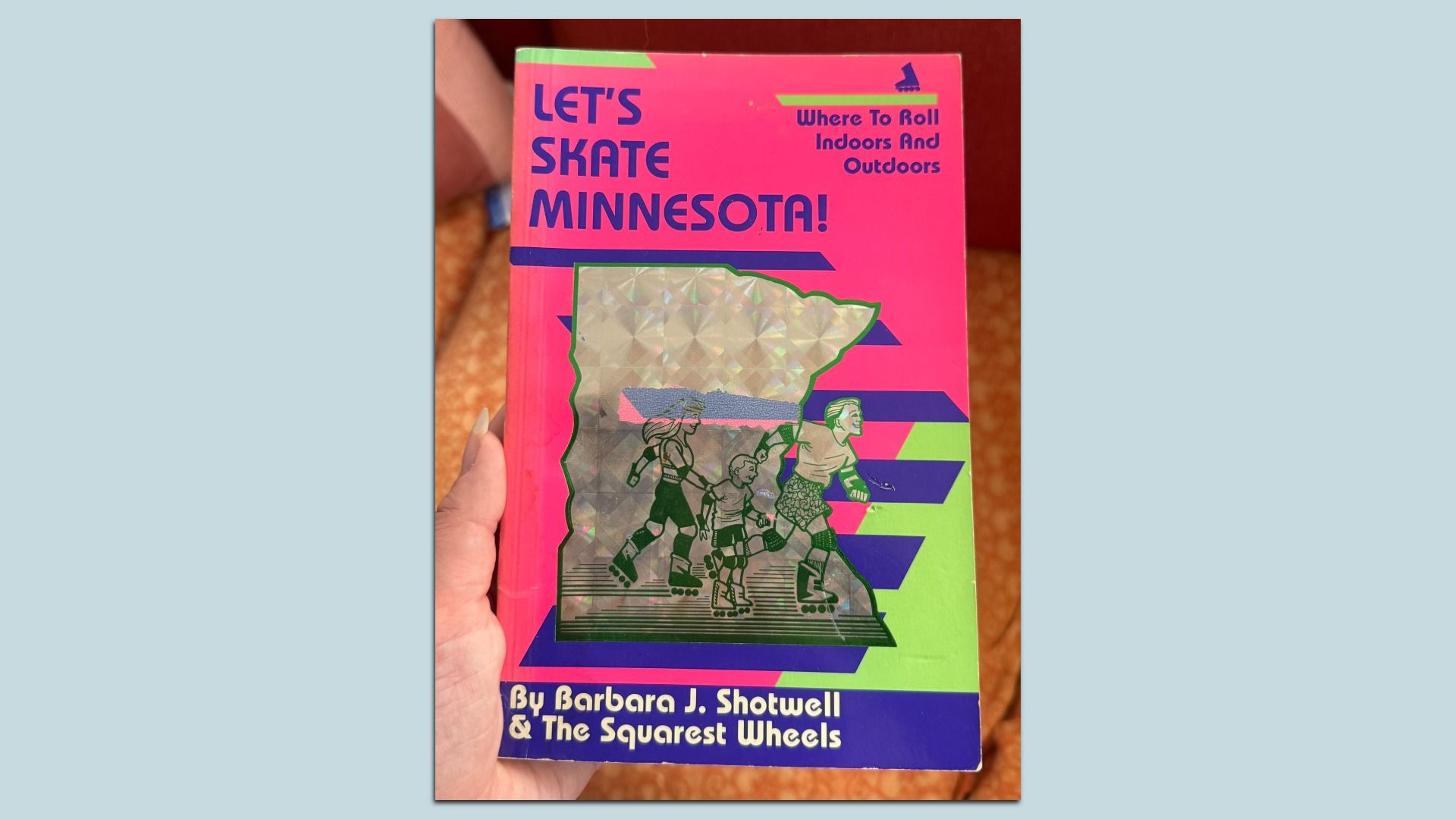 Book cover titled "Let's Skate Minnesota!" with bright pink, green, and blue colors, featuring illustrations of three people roller skating and a holographic map of Minnesota.