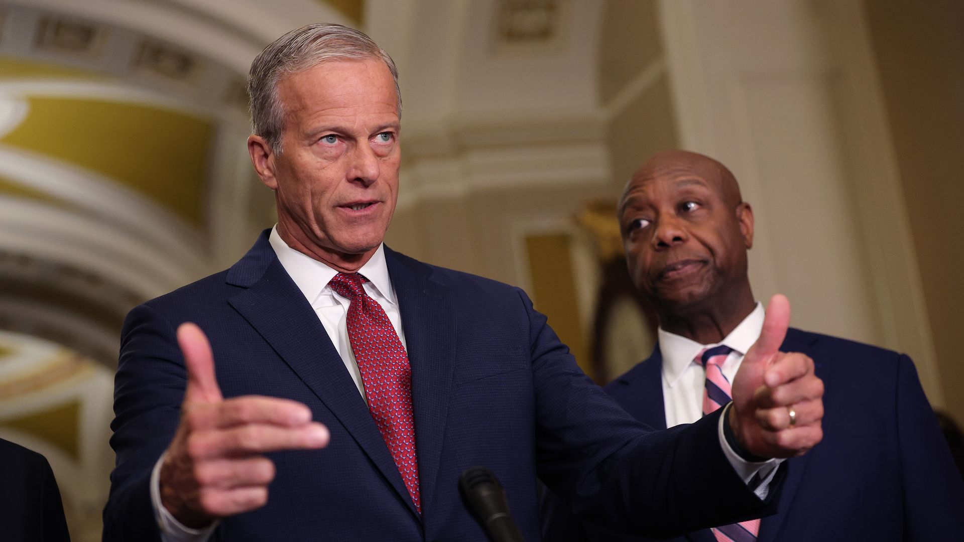 Senate Majority Leader John Thune, joined by National Republican Senatorial Committee Chairman Tim Scott, speaks to reporters at the U.S. Capitol on March 3.