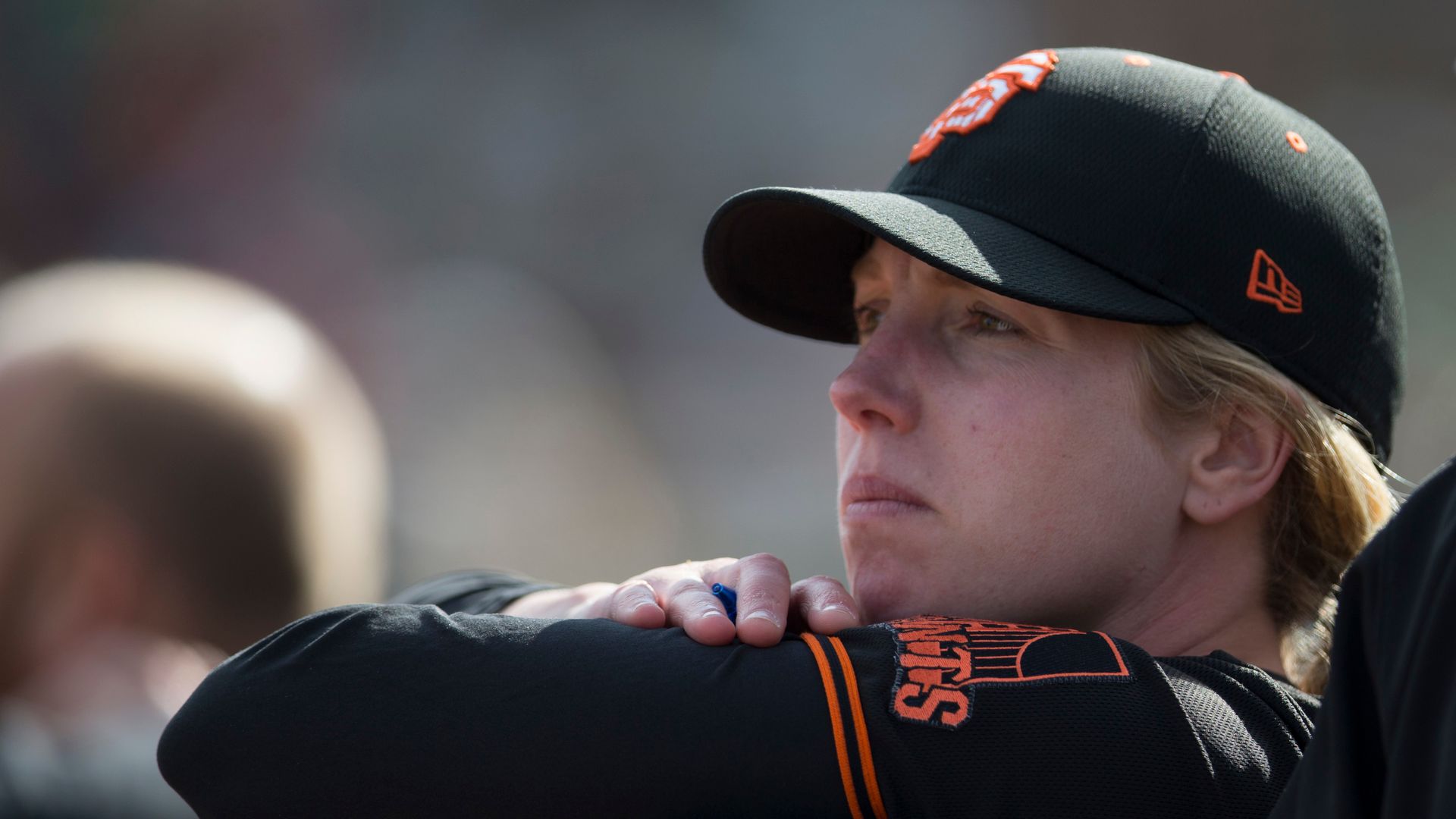  Coach Alyssa Nakken #92 of the San Francisco Giants stands in the dugout during the game against the Oakland Athletics at Hohokam Stadium on February 23, 2020 in Mesa, Arizona.