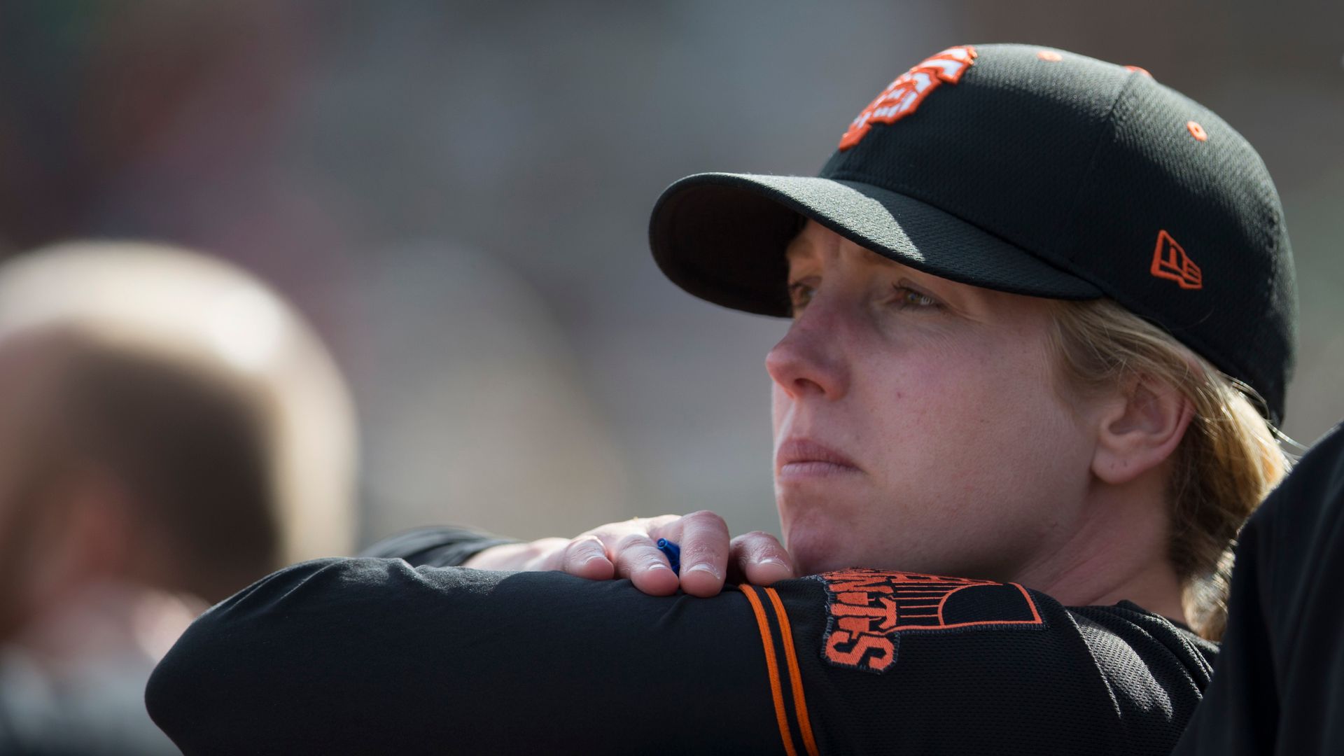 Coach Alyssa Nakken #92 of the San Francisco Giants stands in the dugout during the game against the Oakland Athletics at Hohokam Stadium on February 23, 2020 in Mesa, Arizona.