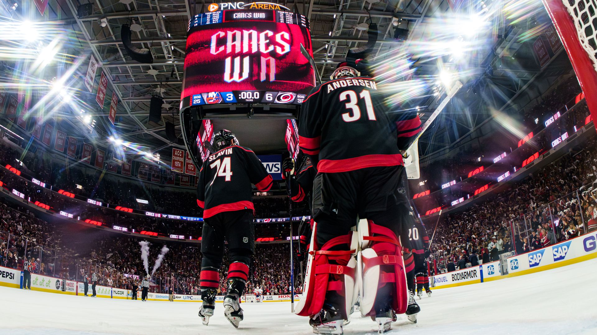 RALEIGH, NORTH CAROLINA - APRIL 30: Frederik Andersen #31 of the Carolina Hurricanes celebrates with teammates after a 6-3 victory against the New York Islanders in Game Five of the First Round of the 2024 Stanley Cup Playoffs at PNC Arena on April 30, 2024 in Raleigh, North Carolina