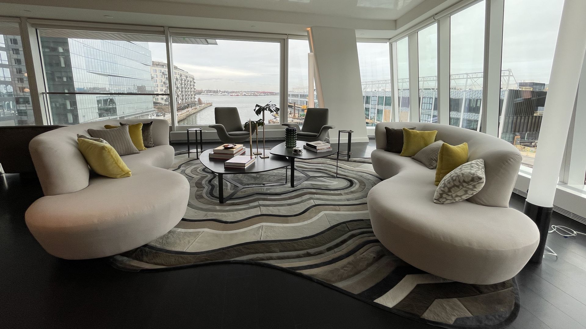 The view inside the St. Regis luxury condos, particularly the living room with waterfront views in a 3-bedroom, 3.5-bath unit.