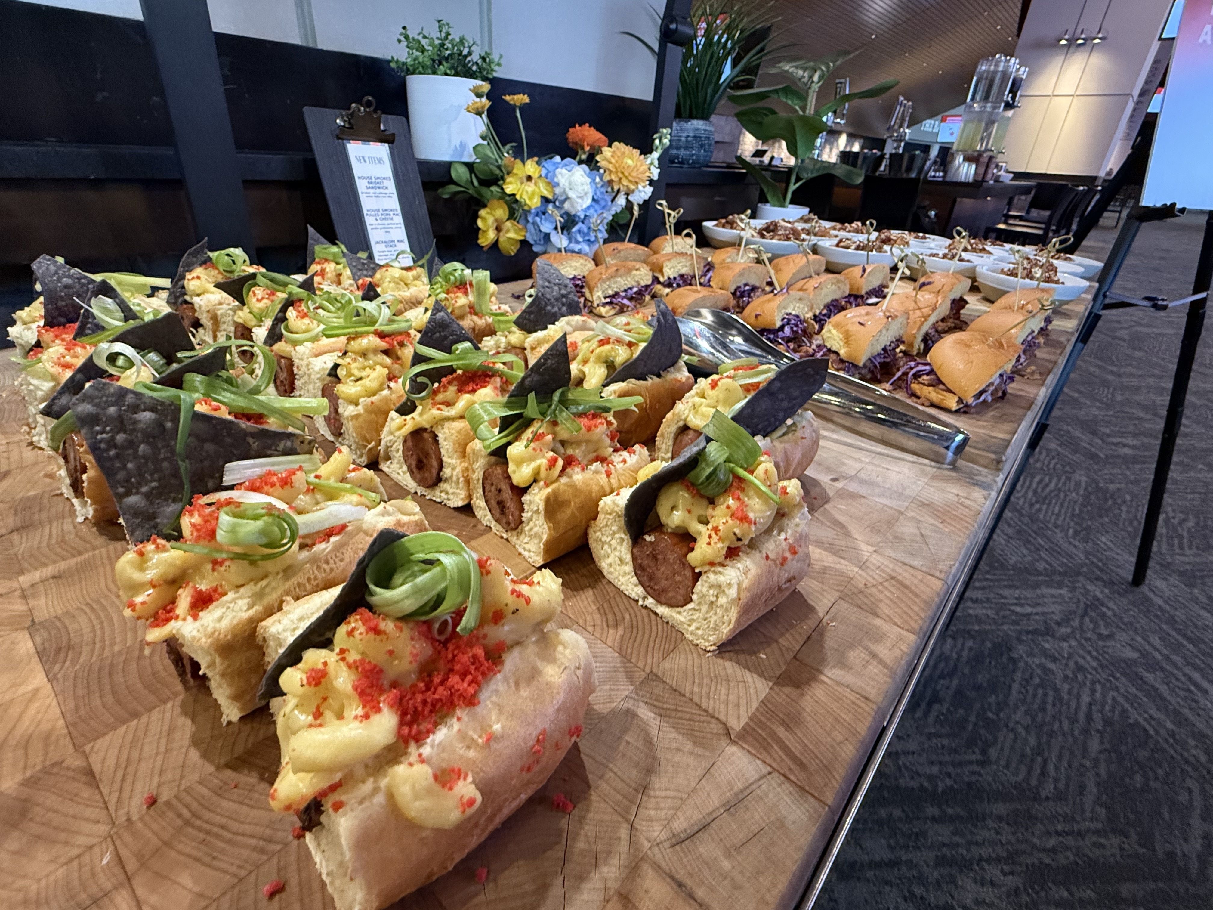 Several small dishes, including a hot dog with various toppings. 