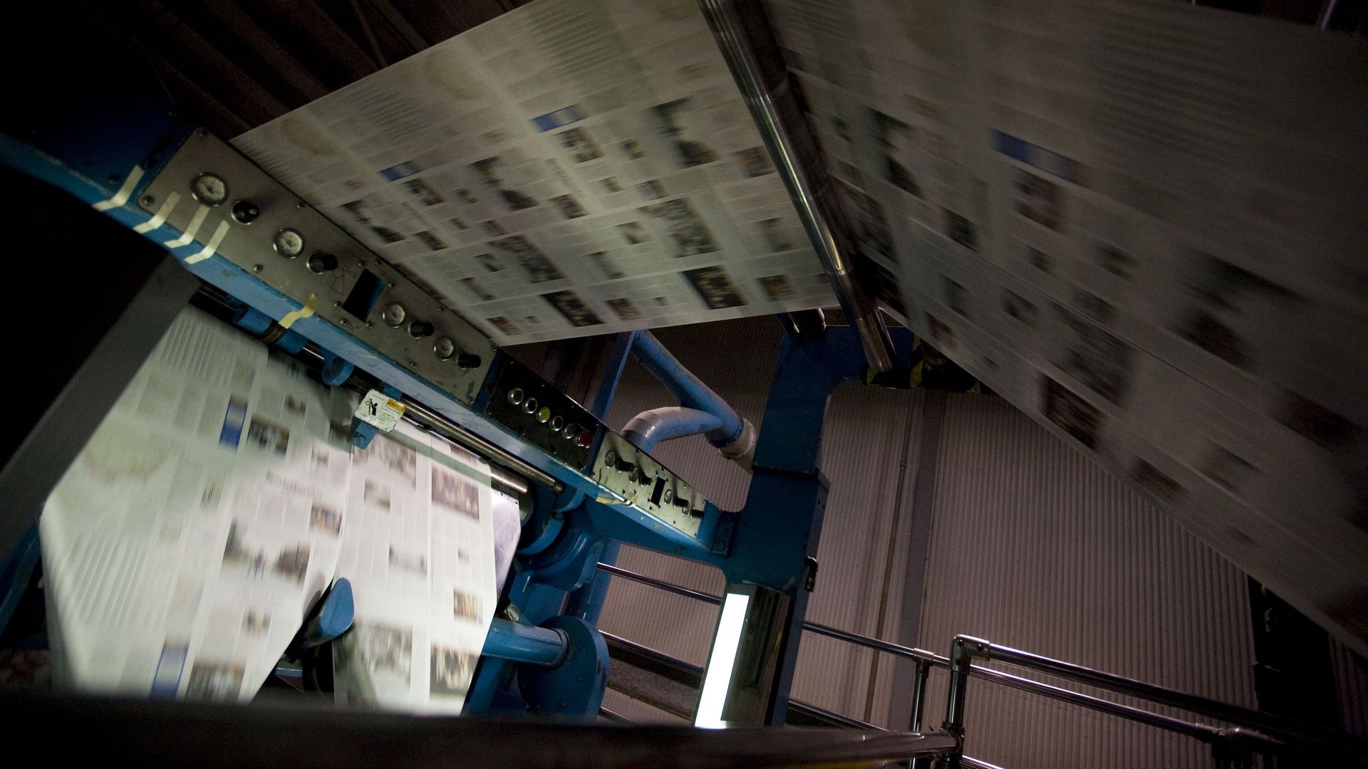 picture of newspapers being printed
