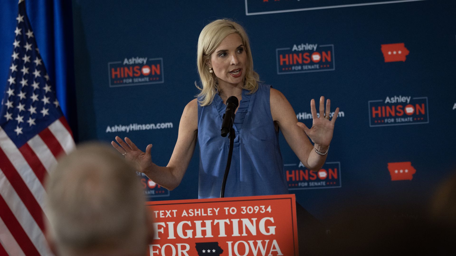 Iowa Republican Senate candidate Ashley Hinson speaks behind a podium.