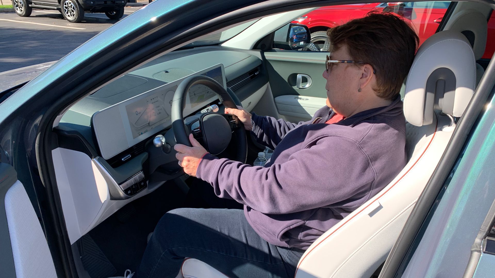 Image of Axios' Joann Muller in the driver's seat of the Hyundai Ionic 5 battery-electric vehicle