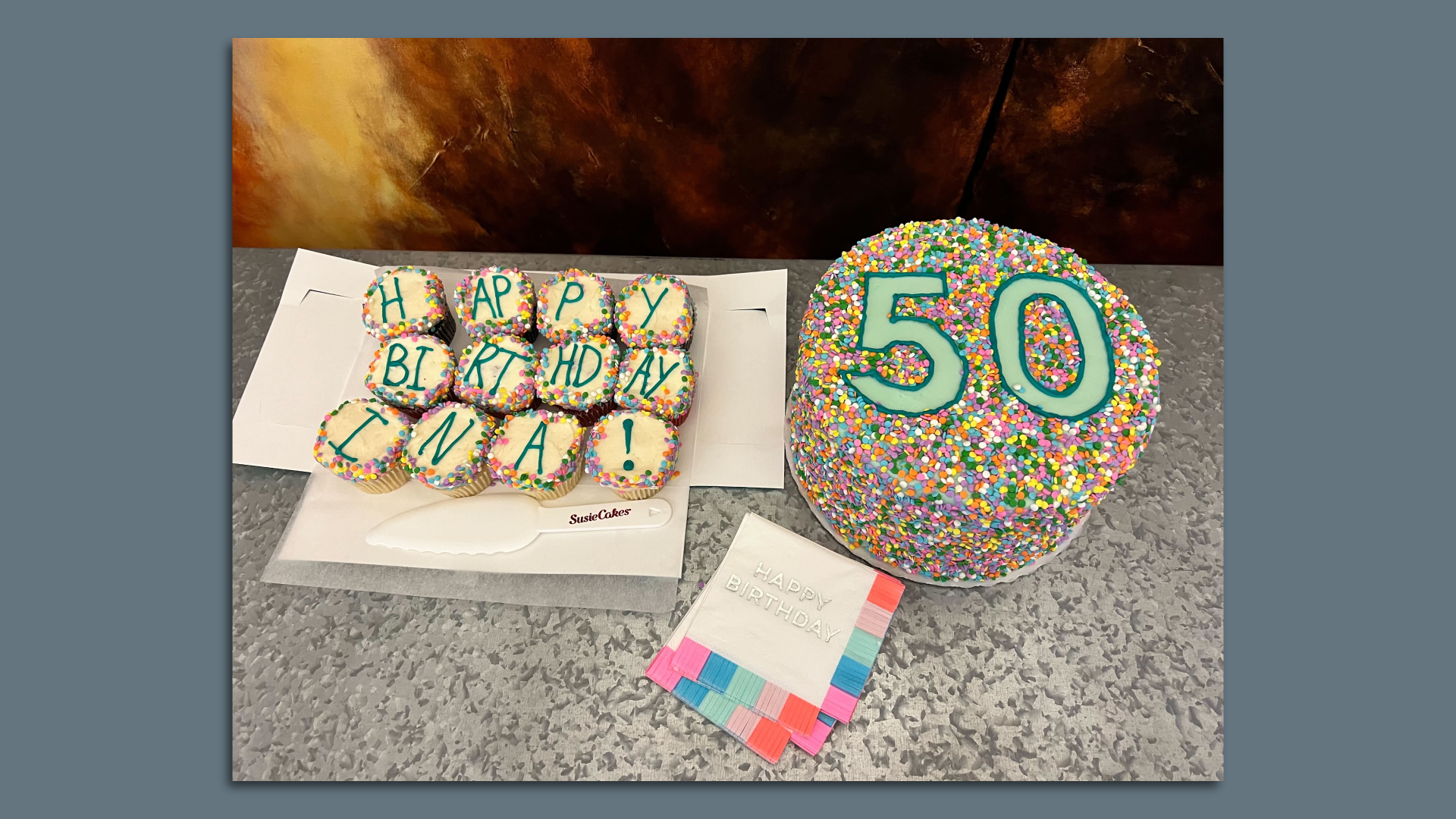 A 50th birthday cake and cupcakes that say Happy Birthday Ina!