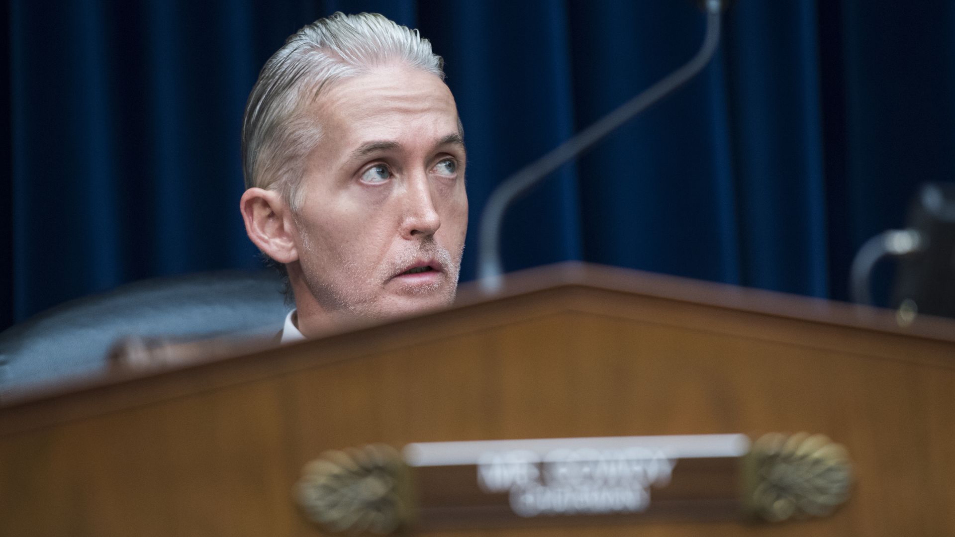 In this image, Trey Gowdy's head is visible from behind a podium as he sits for a hearing