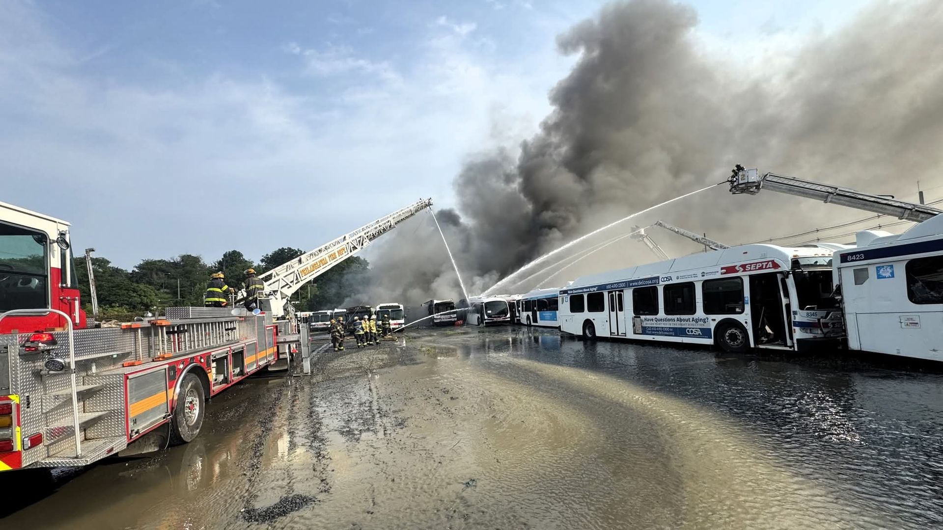 Firefighters at the scene of a fire at a SEPTA bus depot