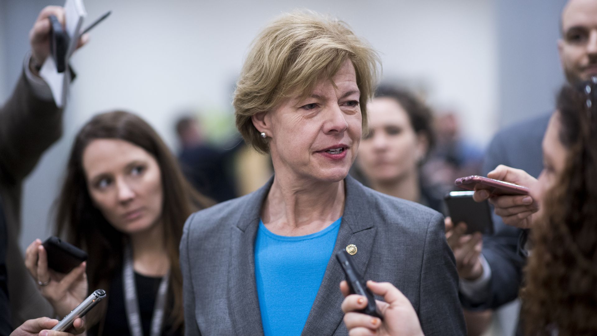 Senator Tammy Baldwin speaks to a group of reporters