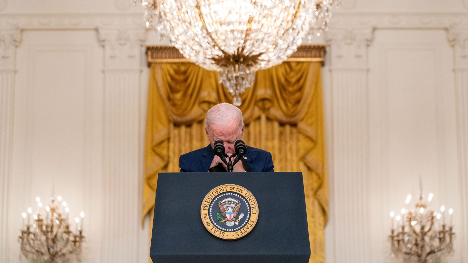 President Biden listens to a question after his address yesterday.
