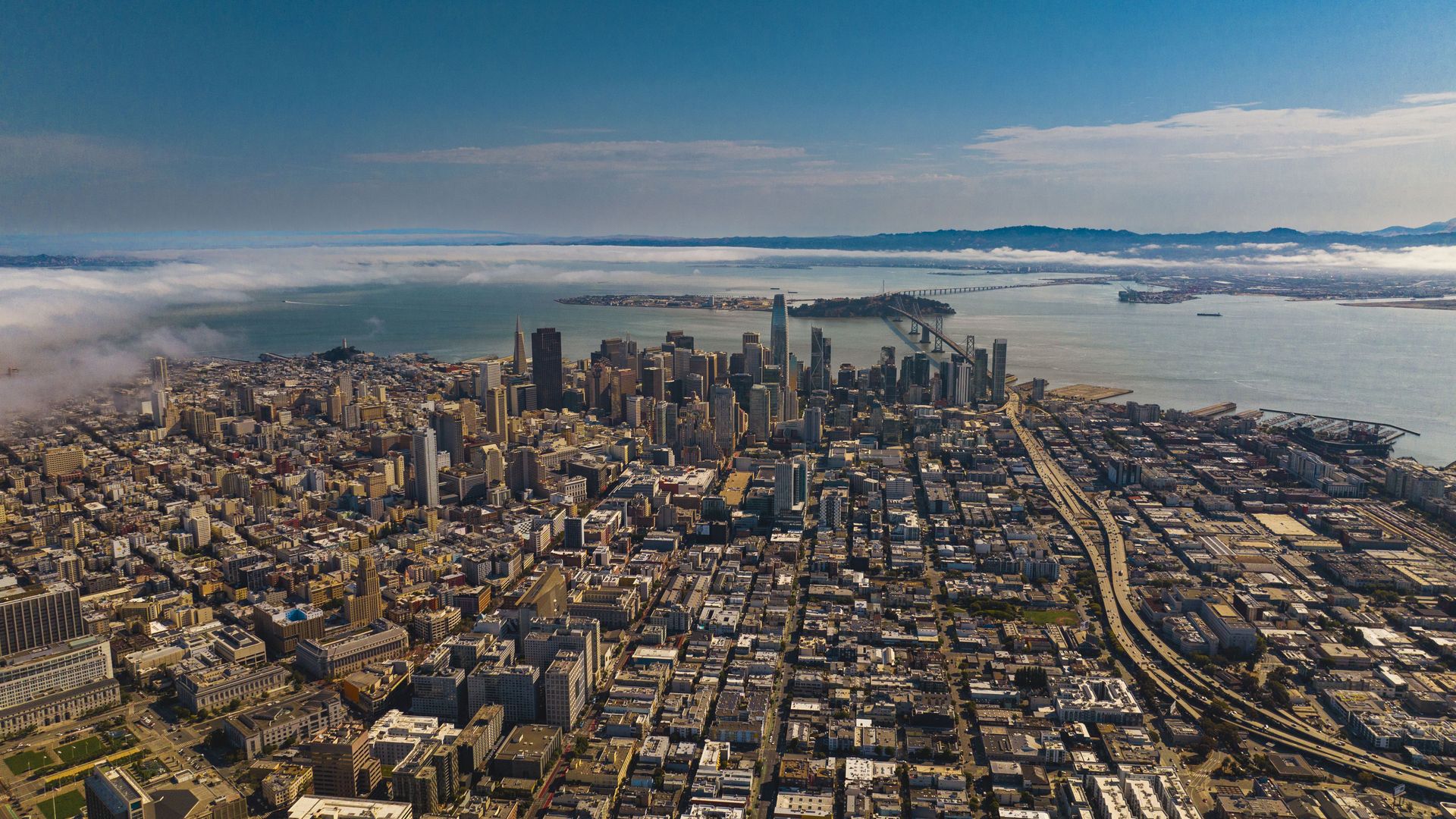 Aerial view from Treasure Island overlooks and the Bay Bridge with morning fog, San Francisco, California. (Photo by: Joe Sohm/Visions of America/Universal Images Group via Getty Images)