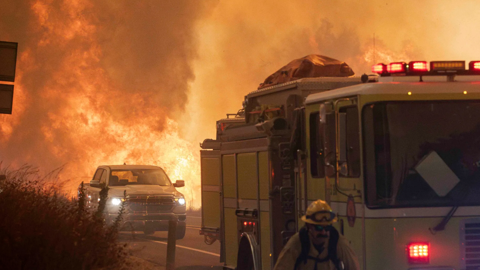 Costa Mesa firefighters scramble as the Airport fire makes across Ortega highway on Sept. 11. 