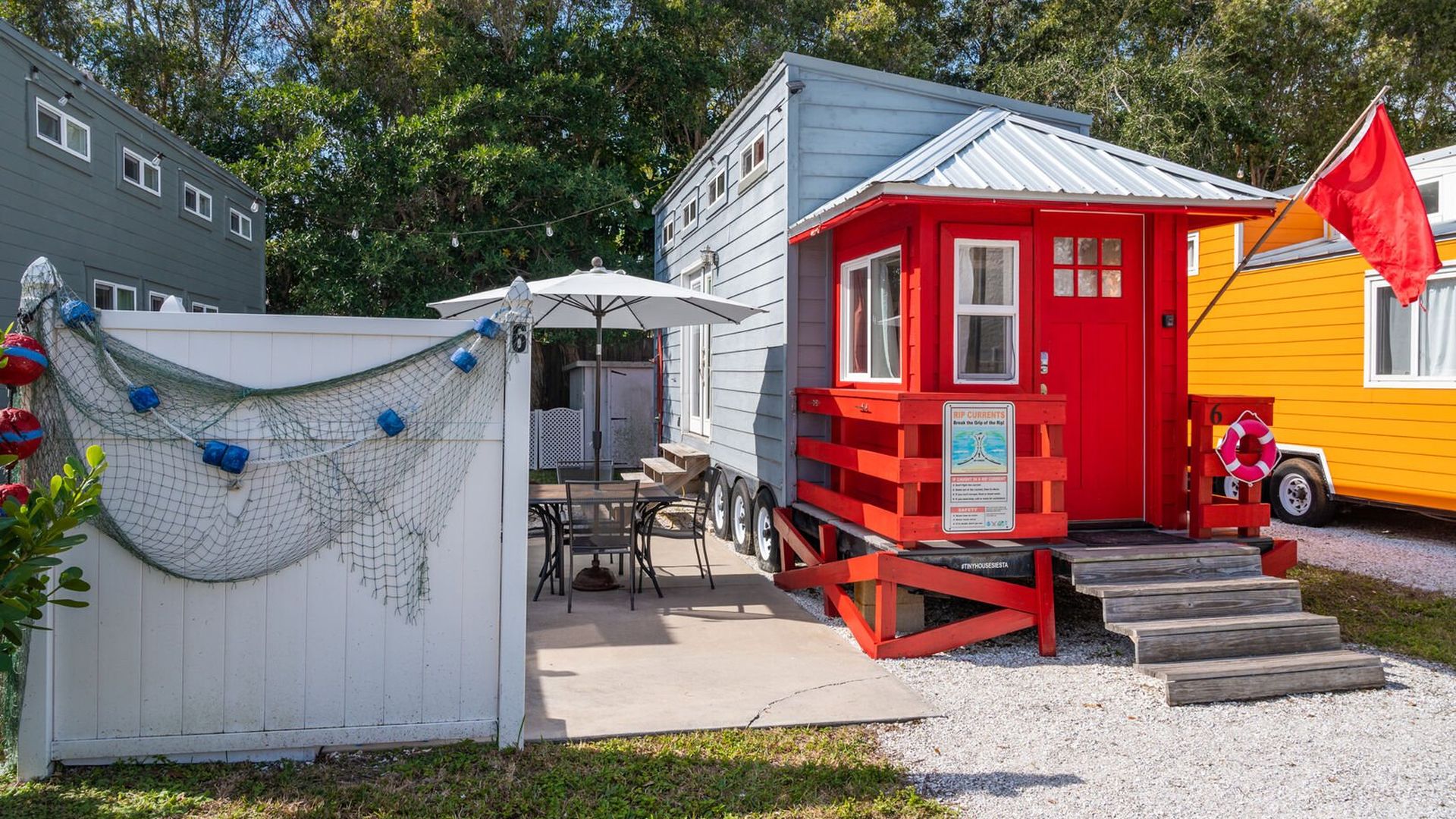 tiny house with a red lifeguard stand front