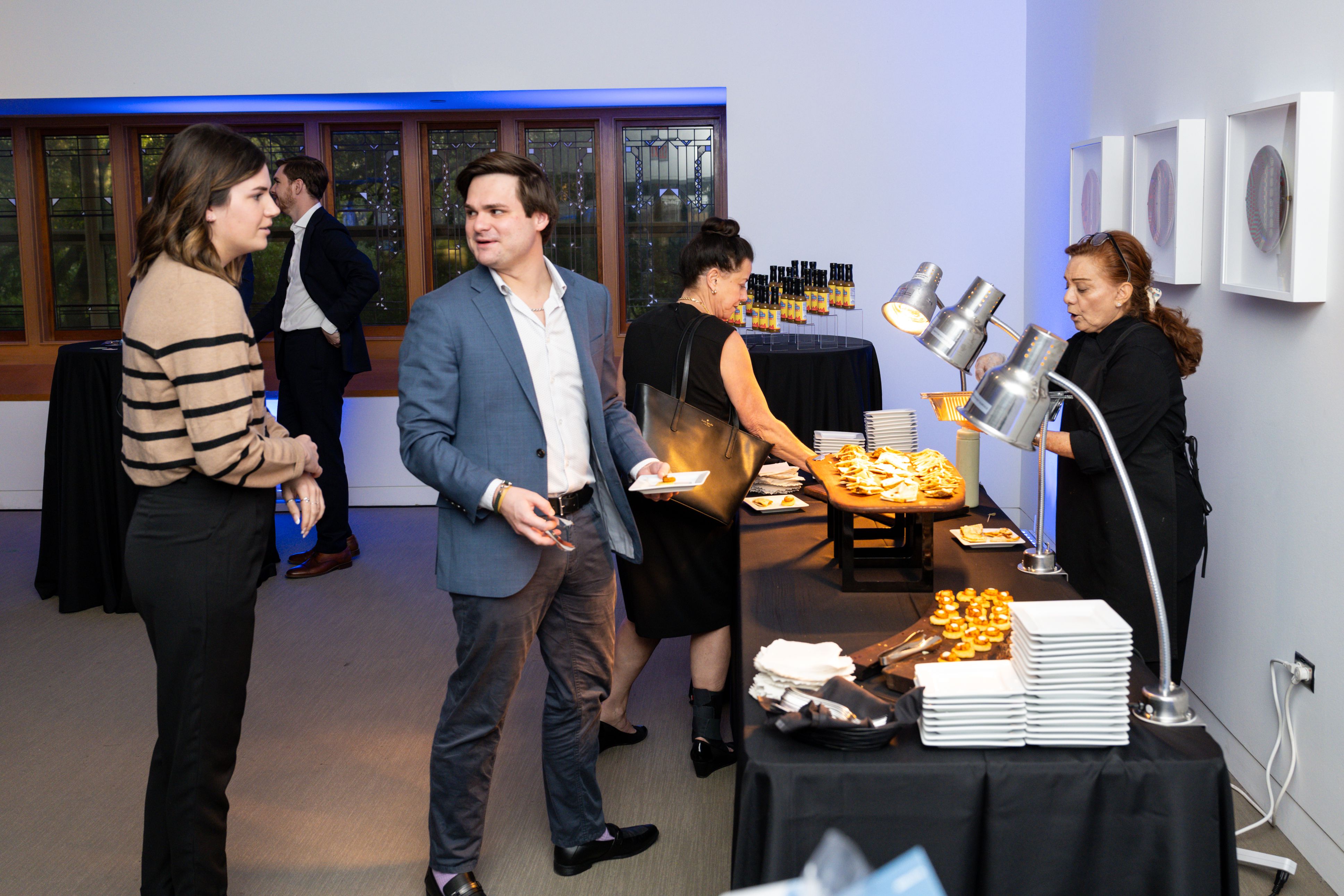 people pick up food from station