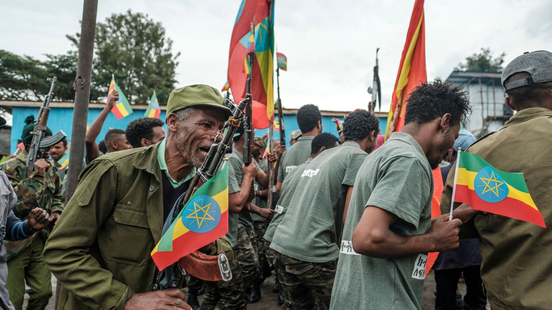 Recruits for reserves of Amhara regional forces, together with members of the Amhara militia, celebrate during their graduation ceremony, in the city of Dessie, Ethiopia, on August 24, 2021
